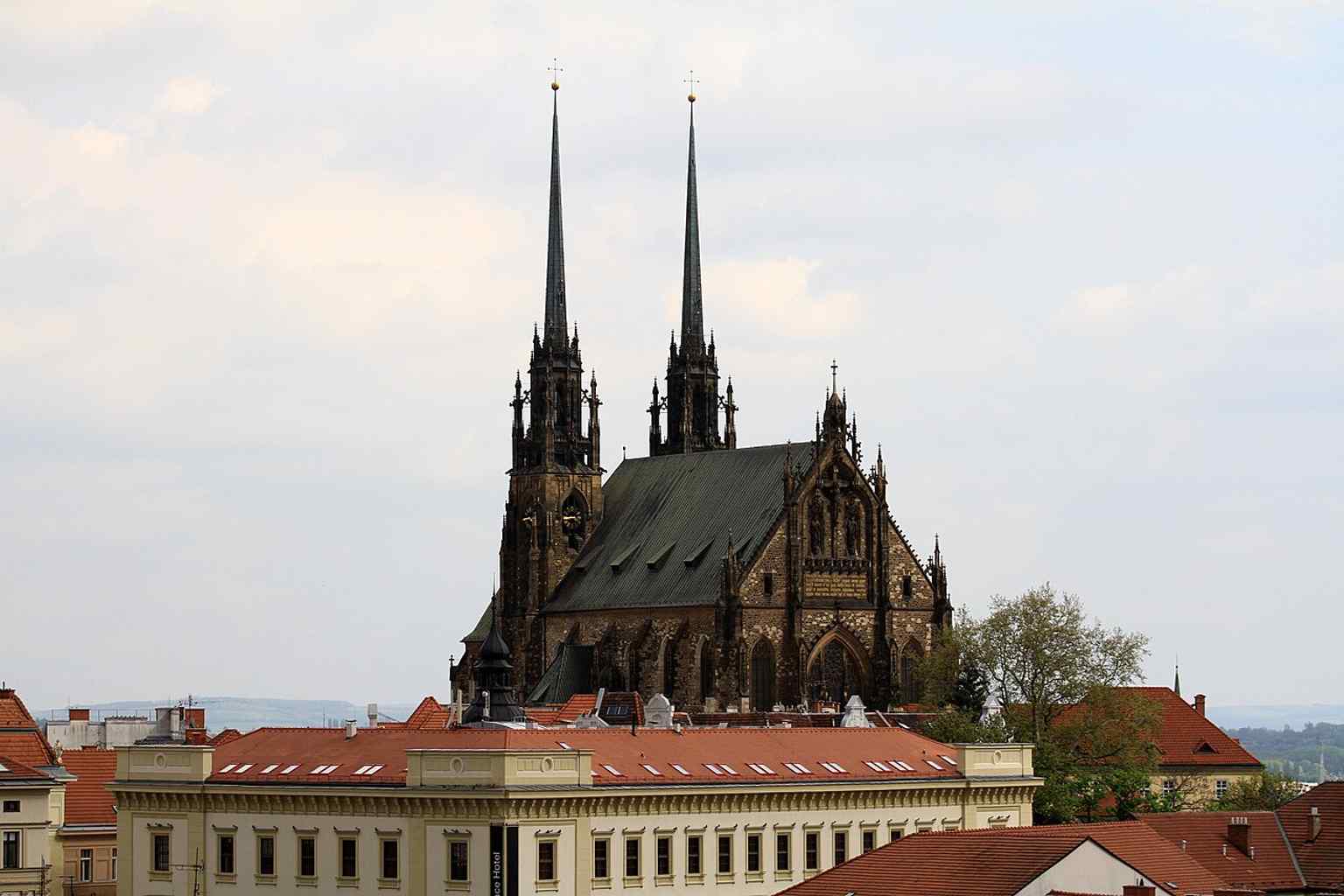 The cathedral and the wider Petrov complex in one frame, showing why this site became such a major Brno landmark.