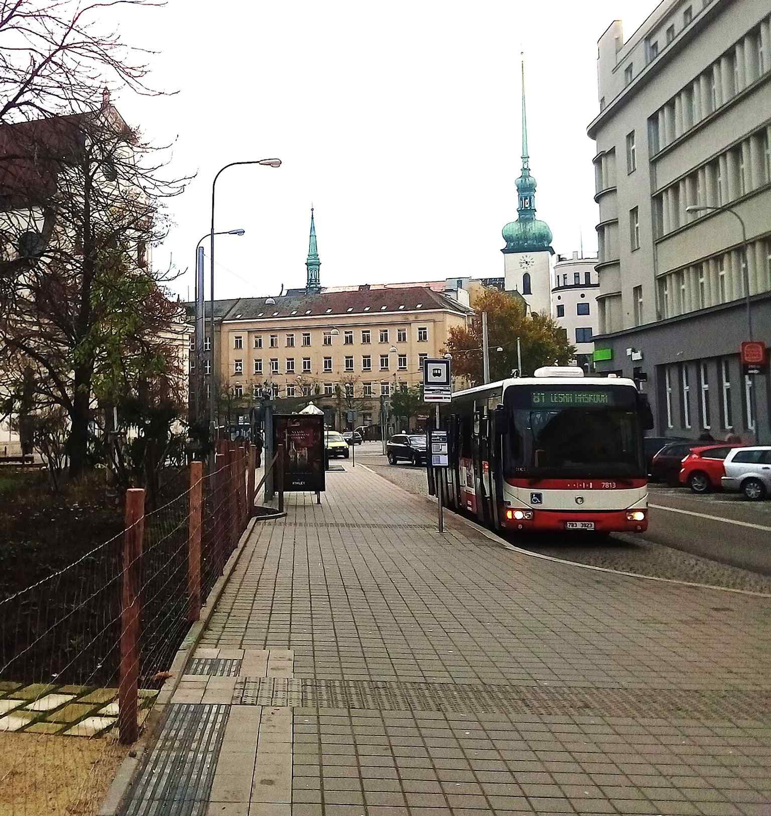 A bus at the Moravian Square stop, showing the square’s role as a busy public transport hub with tram and bus connections.