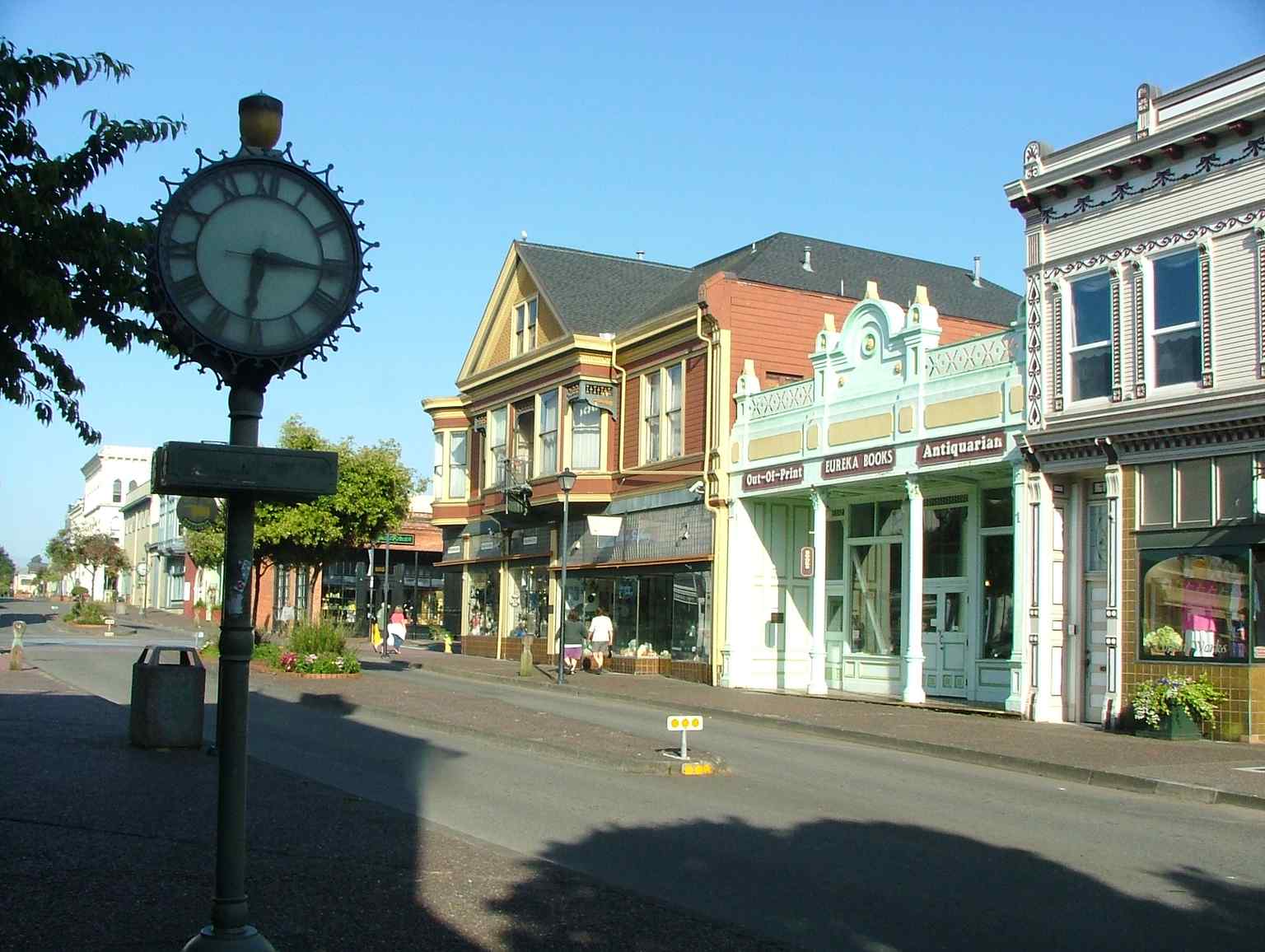 The iconic street clock stands sentry in Old Town Eureka, surrounded by meticulously preserved Victorian storefronts. (2006)