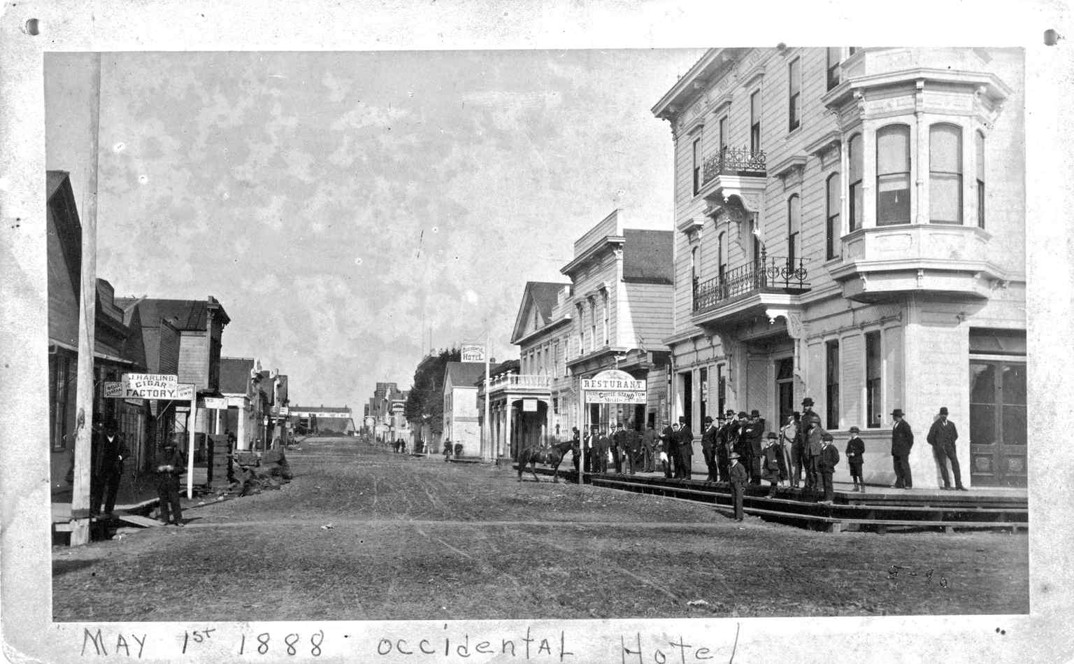 A bustling but rough 2nd Street in 1888, showcasing the volatile reality of Eureka's booming seaport days.