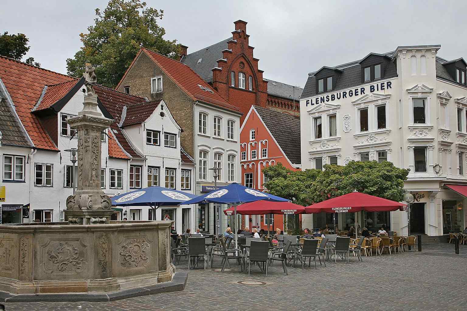 The Neptun Fountain on Flensburg’s Nordermarkt, the baroque centerpiece that today defines the square and became famous for the Duborg-Skolen “Neptune baptism” ritual.