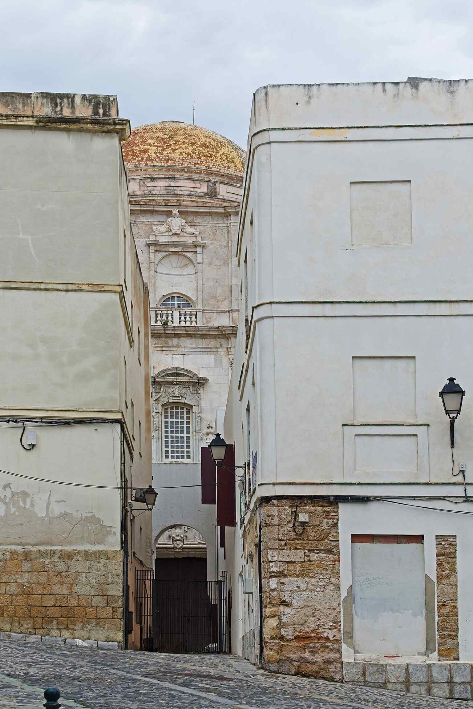 The cathedral beside the Arco del Obispo, a useful context shot for its setting in Cádiz’s historic center near the old cathedral.