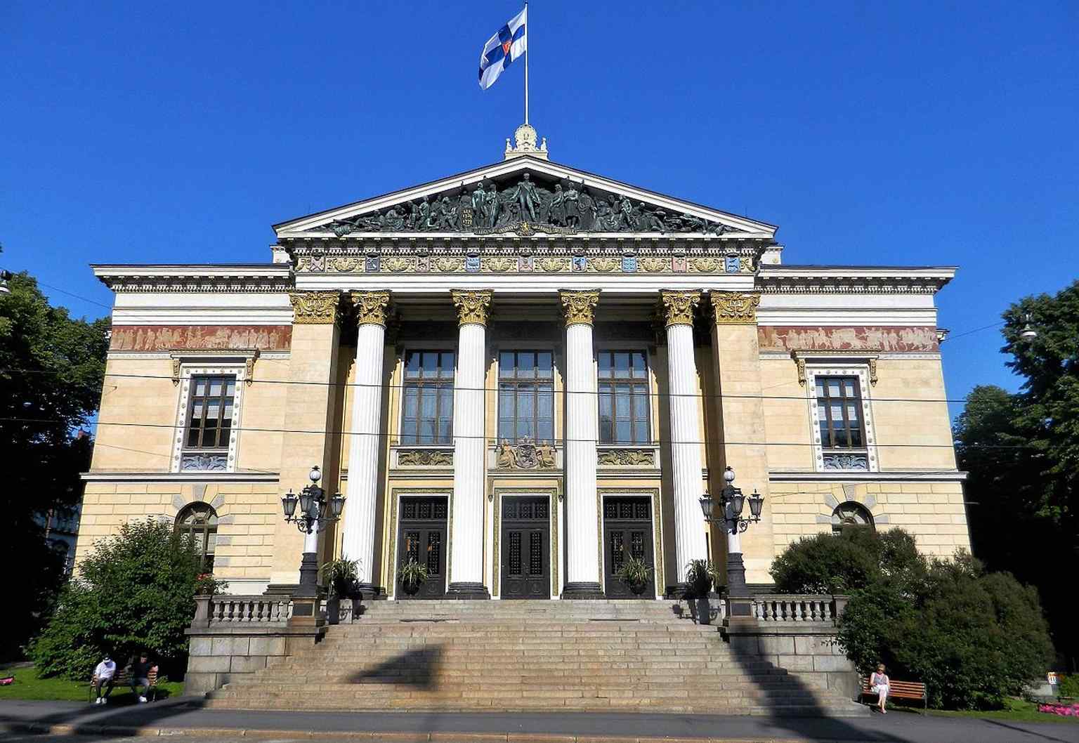The main building with flags flying — a fitting view for a house now used for state meetings and government negotiations.
