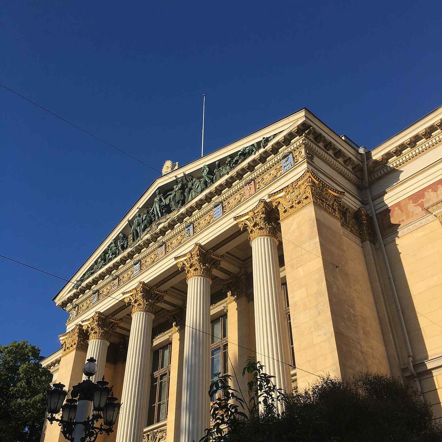 A close look at the columned facade, echoing the building’s temple-like classical front described in the source text.