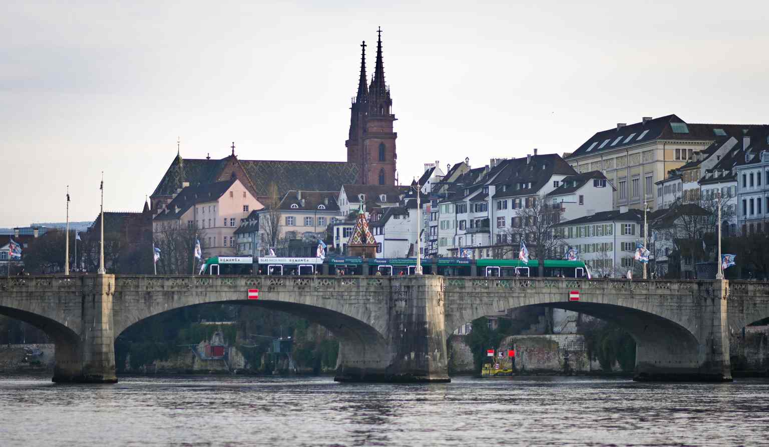 The classic stone arches of the modern Middle Bridge, deliberately designed to perfectly match the historic Basel Minster in the background. (2026)