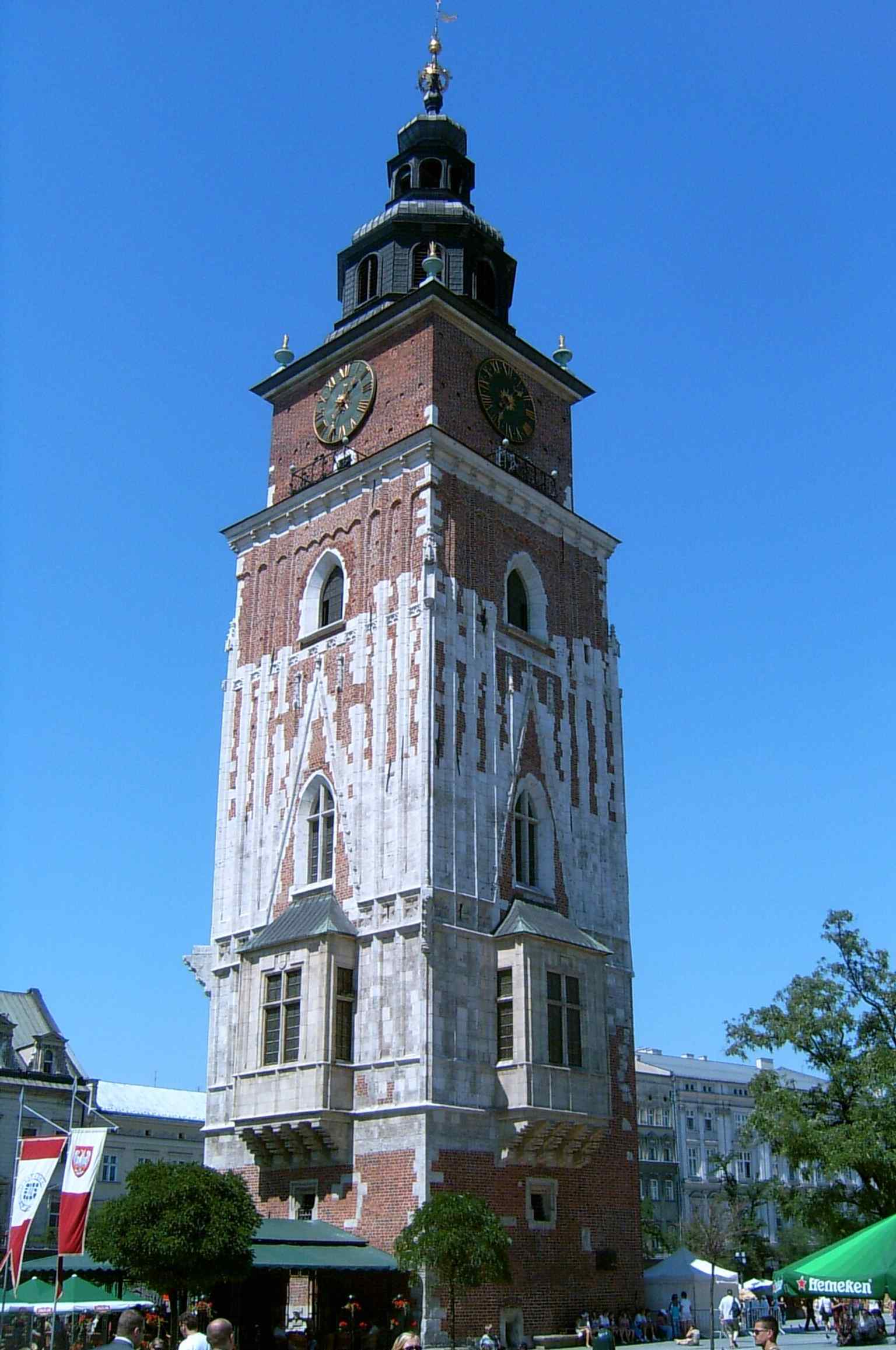 A clear daytime view of the Town Hall Tower rising above Kraków’s Main Market Square, the lone survivor of the old Town Hall that was demolished in 1820.
