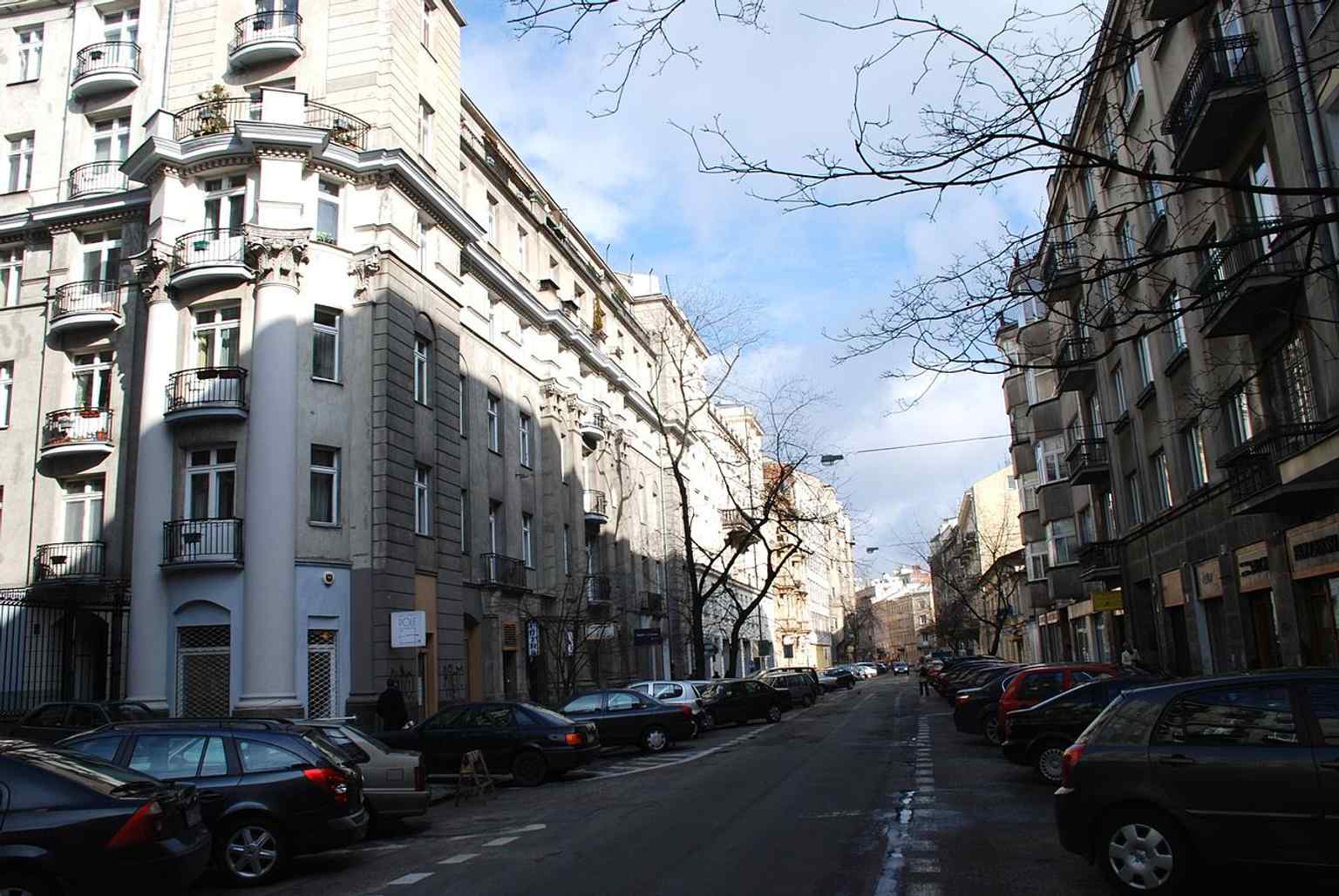 Mokotowska seen from Piękna, a modern streetscape that still follows the historic route toward the former Mokotowo village.