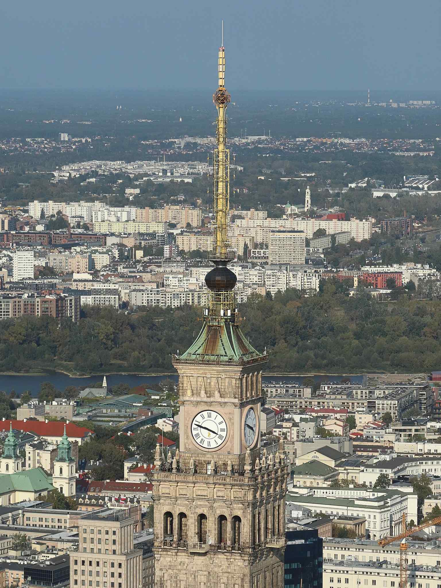 A closer rooftop view that spotlights the spire and antenna section, the part that brings the building to its full 237-meter height.