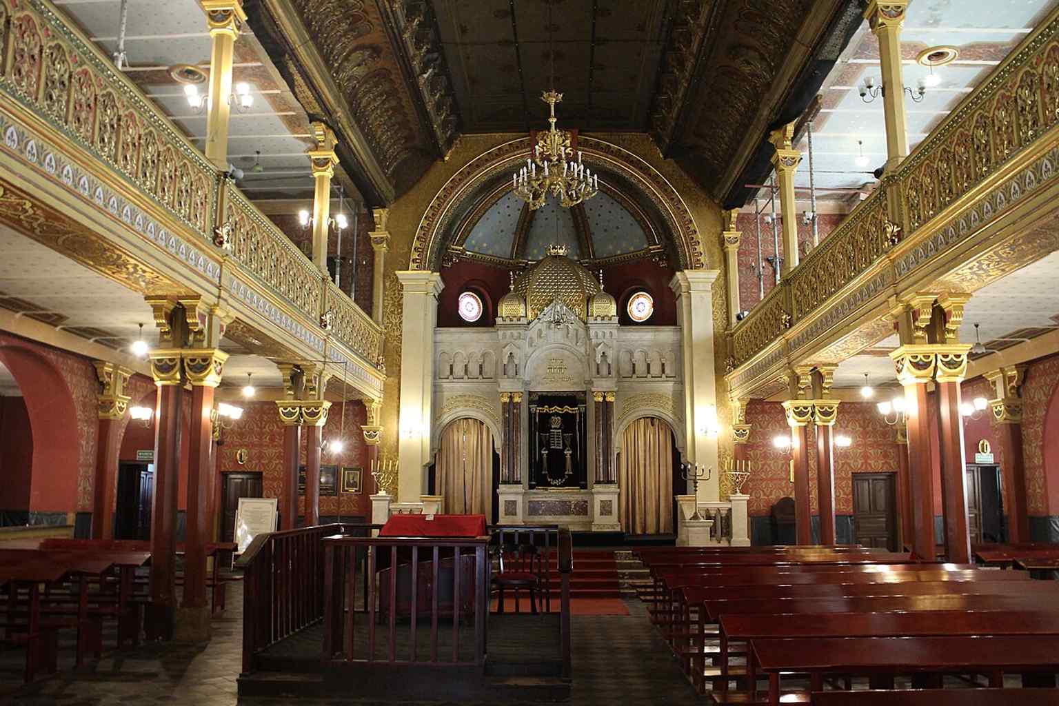 The synagogue interior during a service, with the richly decorated sanctuary still used for prayer and cultural events today.