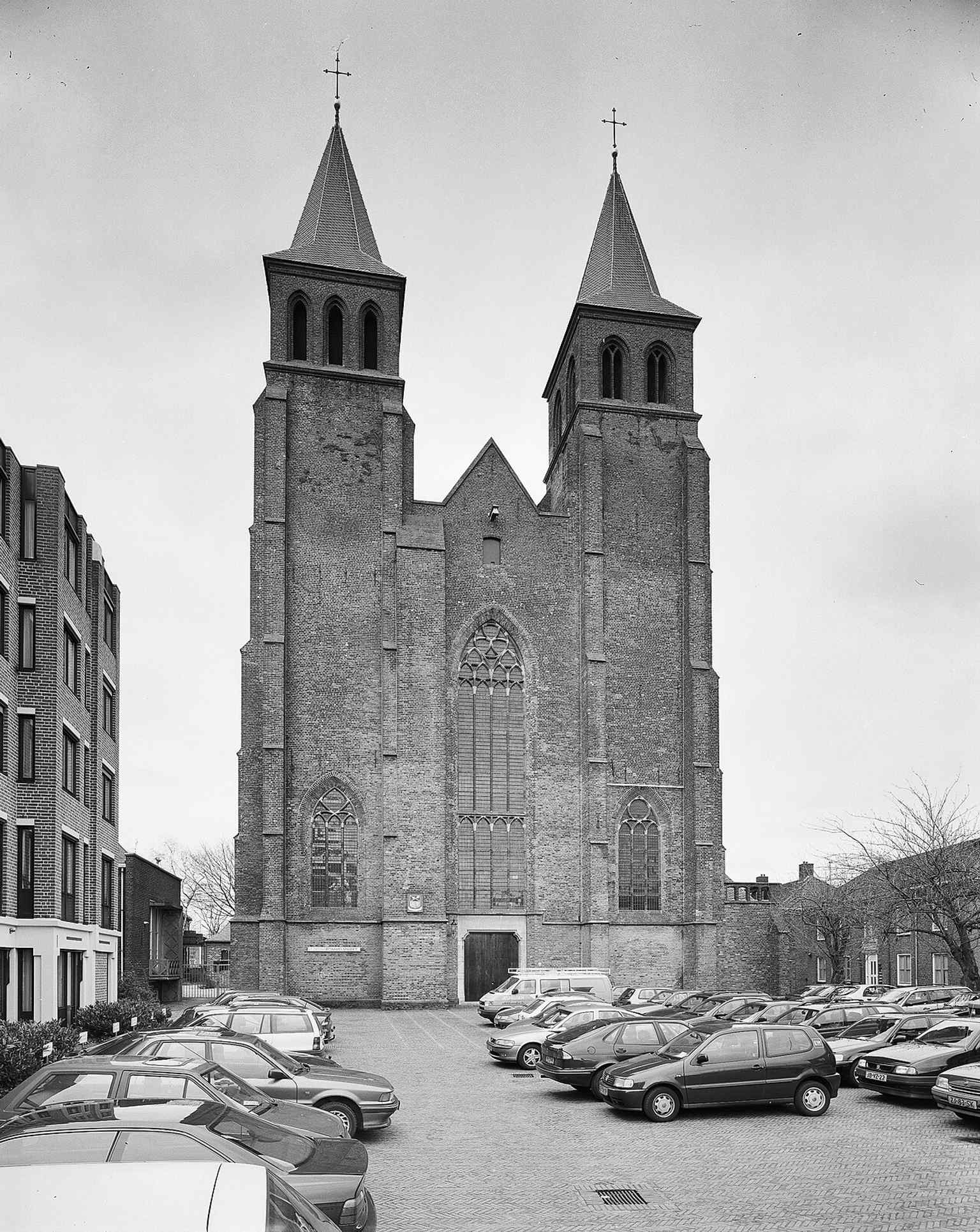 The west façade’s twin towers, one of the church’s most distinctive Gothic features and a rare double-tower front in the Netherlands.