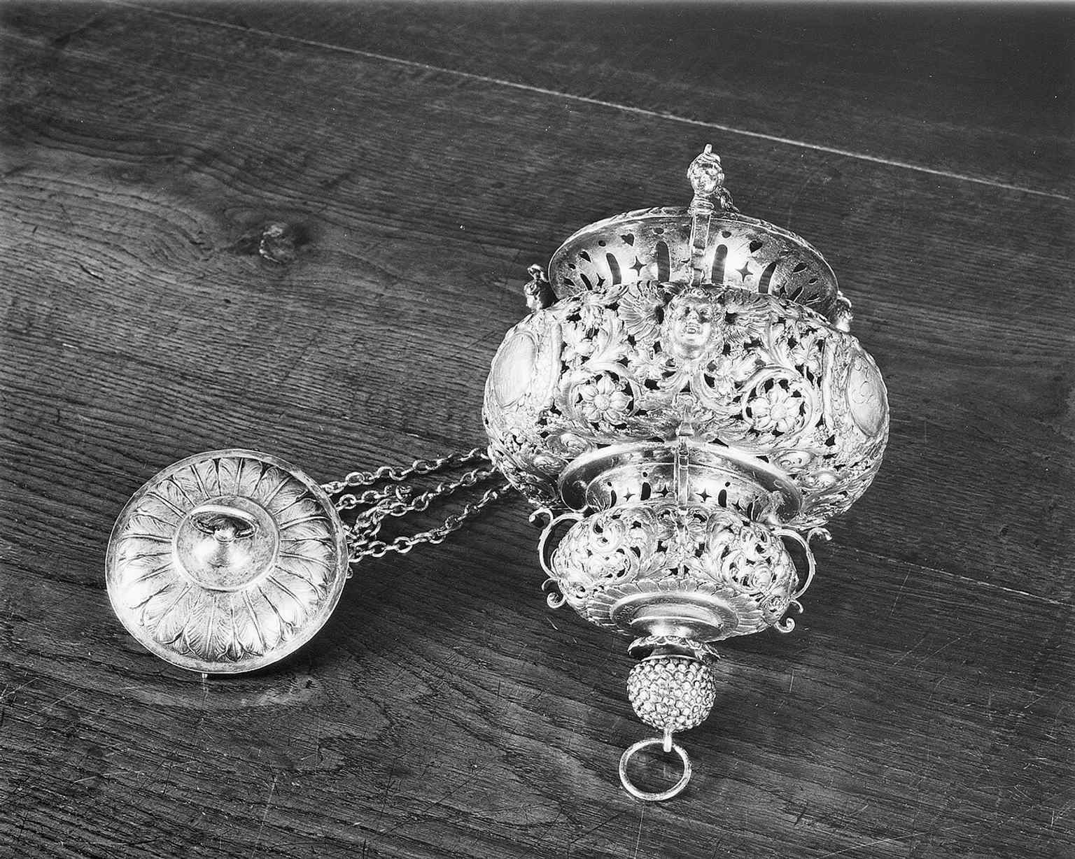 The sanctuary lamp is one of the surviving interior treasures, showing how richly the church was furnished after restoration.