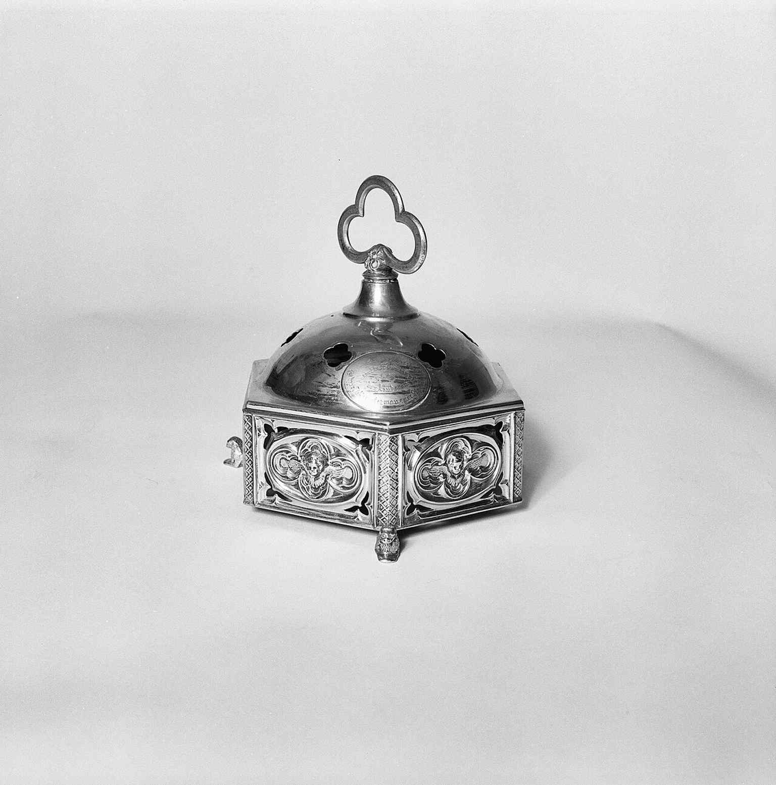 An altar bell from the church interior, a small but evocative object from the liturgical life that ended in 2013.