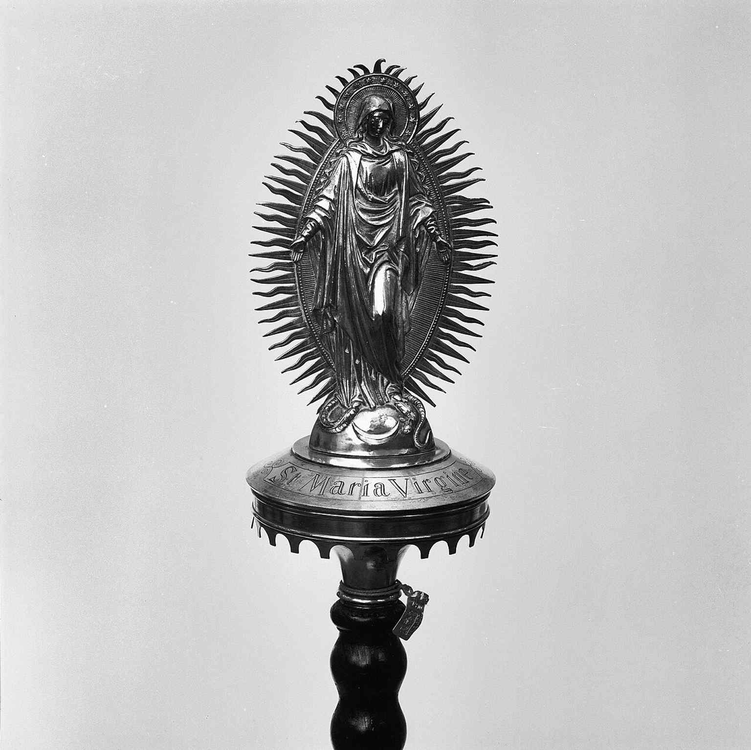 A Kevelaer procession staff preserved inside the church, hinting at the devotional objects that remained after later transformations.