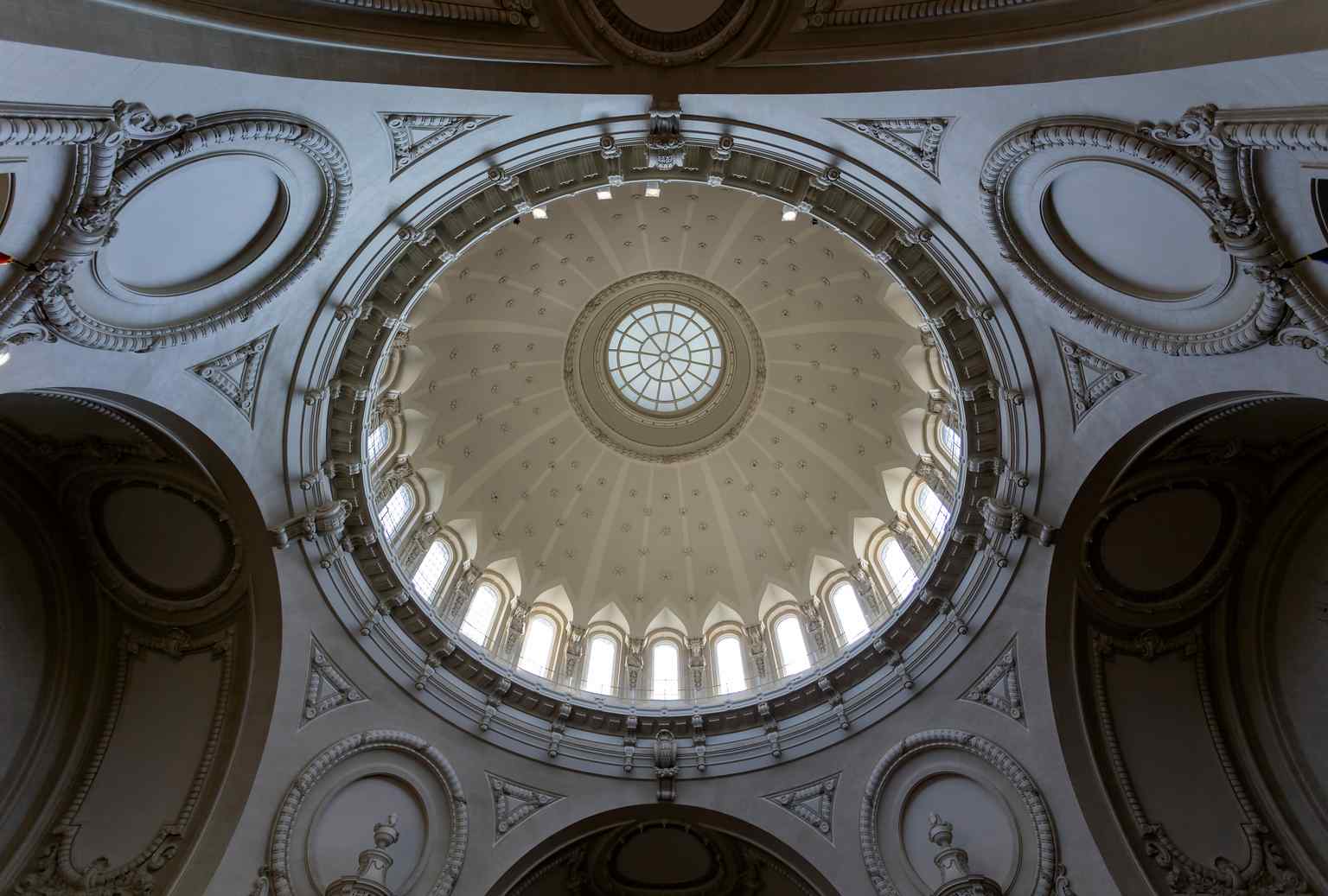 The chapel's iconic dome, now clad in copper, was originally nicknamed 'the frosted wedding cake' due to its porous terracotta cladding.