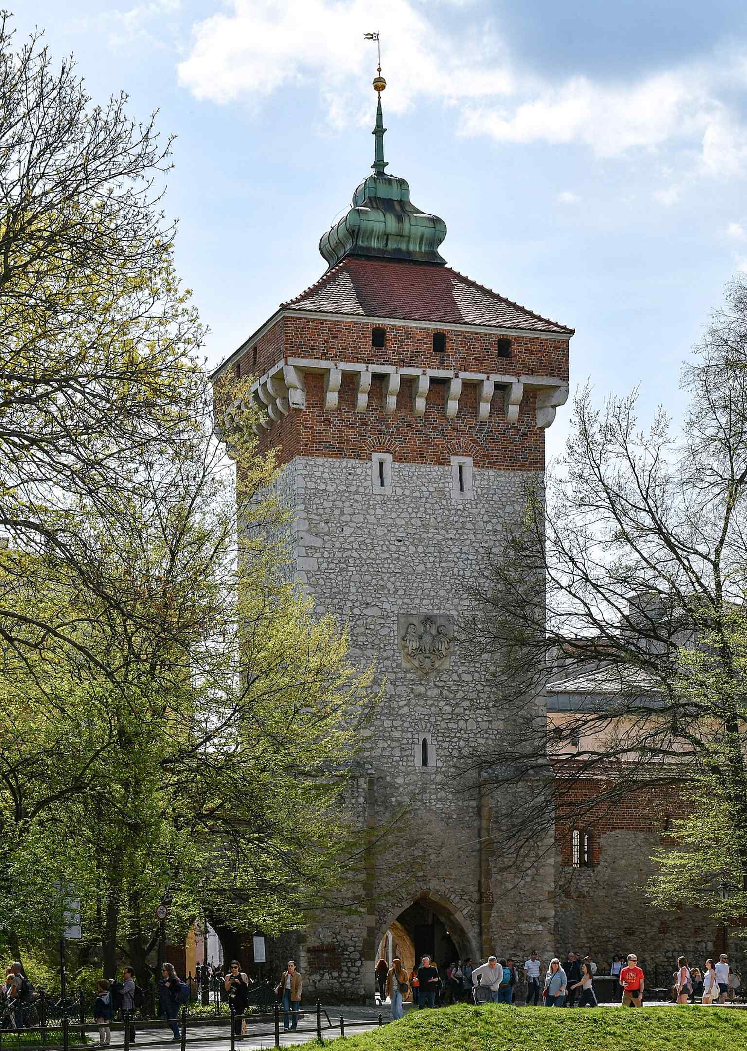 A clear frontal view of St. Florian's Gate, the surviving medieval gateway that once marked the main entrance to Kraków's Old Town.