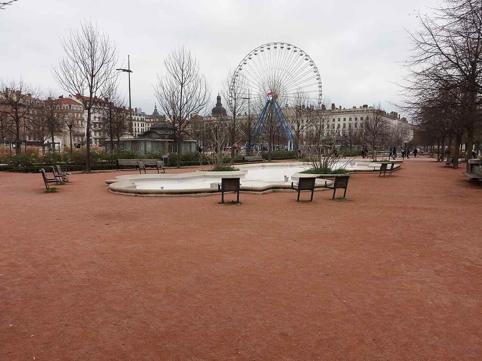 Bellecour with the seasonal Ferris wheel on the east side — a recurring winter landmark during the Fête des Lumières.