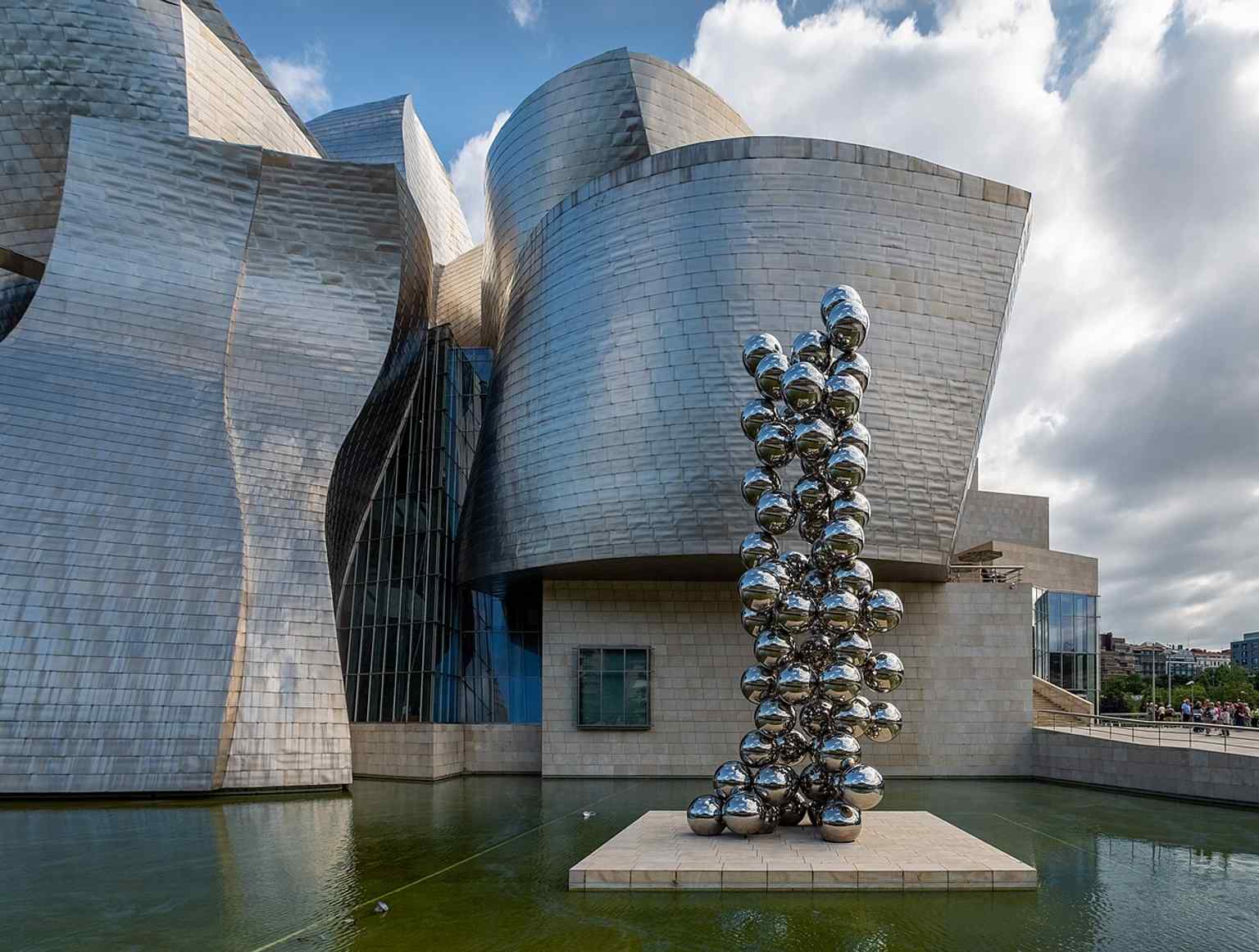 Anish Kapoor’s Tall Tree and the Eye beside the museum, echoing the building’s reflective surfaces and bold sculptural language.