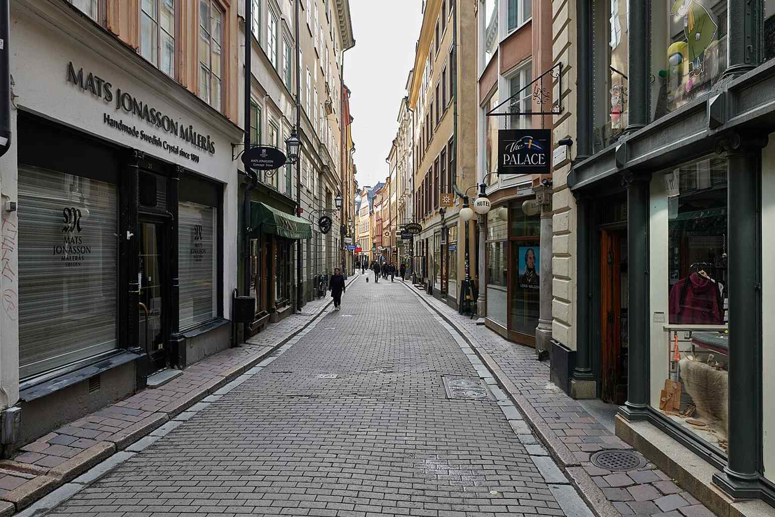 A street-level perspective of Västerlånggatan’s crowded façades, useful for the story of its shops, signs, and layered historic buildings.