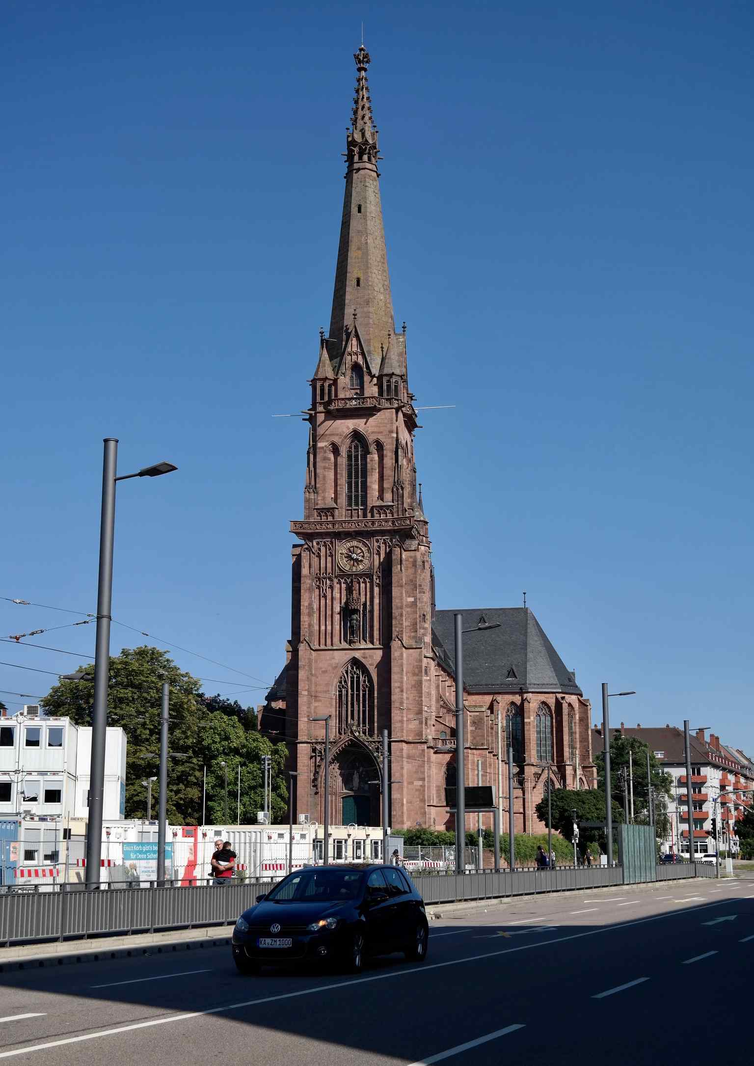 The impressive St. Bernhard Church, a Catholic landmark inaugurated in 1901, is one of two churches prominently located on the Durlacher Allee, adding to the street's rich architectural history.