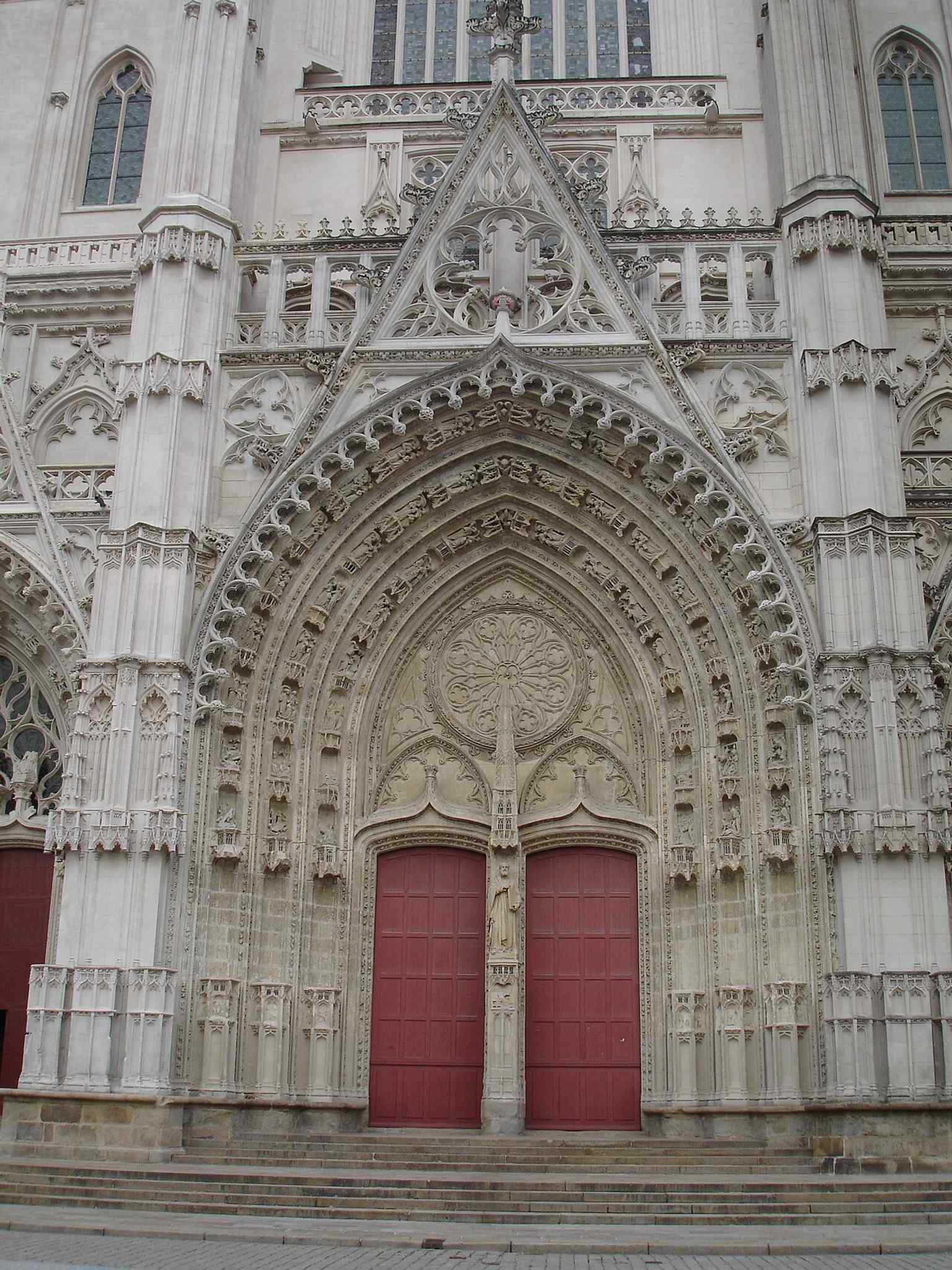 One of the cathedral’s richly carved doors — the façade is known for its five decorated portals and the rare external pulpit beside the entrance.