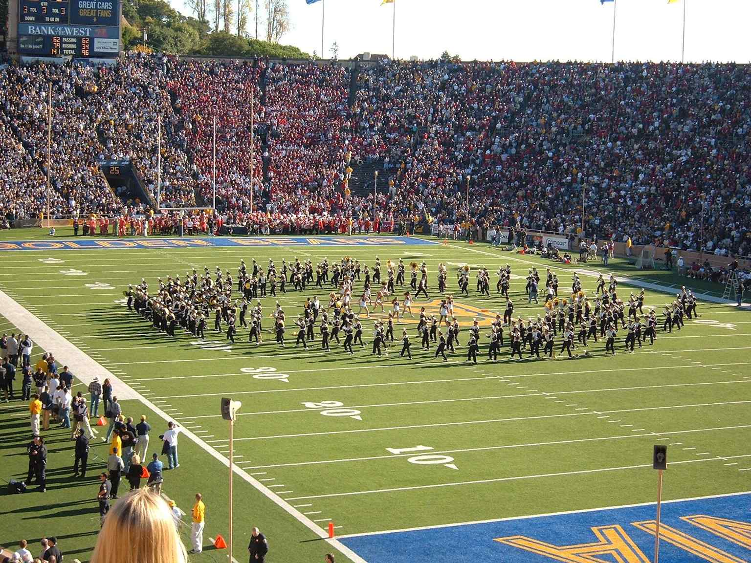 The Cal Band performing before the Big Game evokes the stadium’s role as the center of campus football pageantry and rivalry with Stanford.
