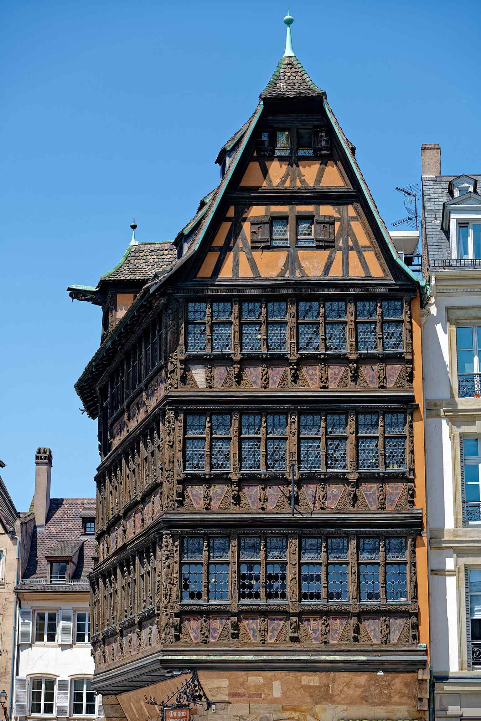 A high-resolution modern facade view from Place de la Cathédrale, emphasizing the building’s survival as Strasbourg’s oldest still-used house.