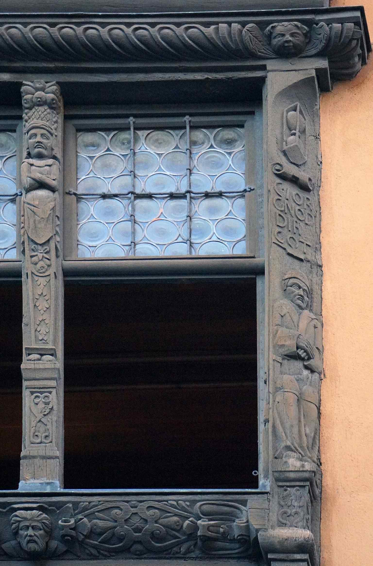 One of the sculpted facade figures, part of the exuberant program of saints, virtues, and historical imagery carved into the walls.