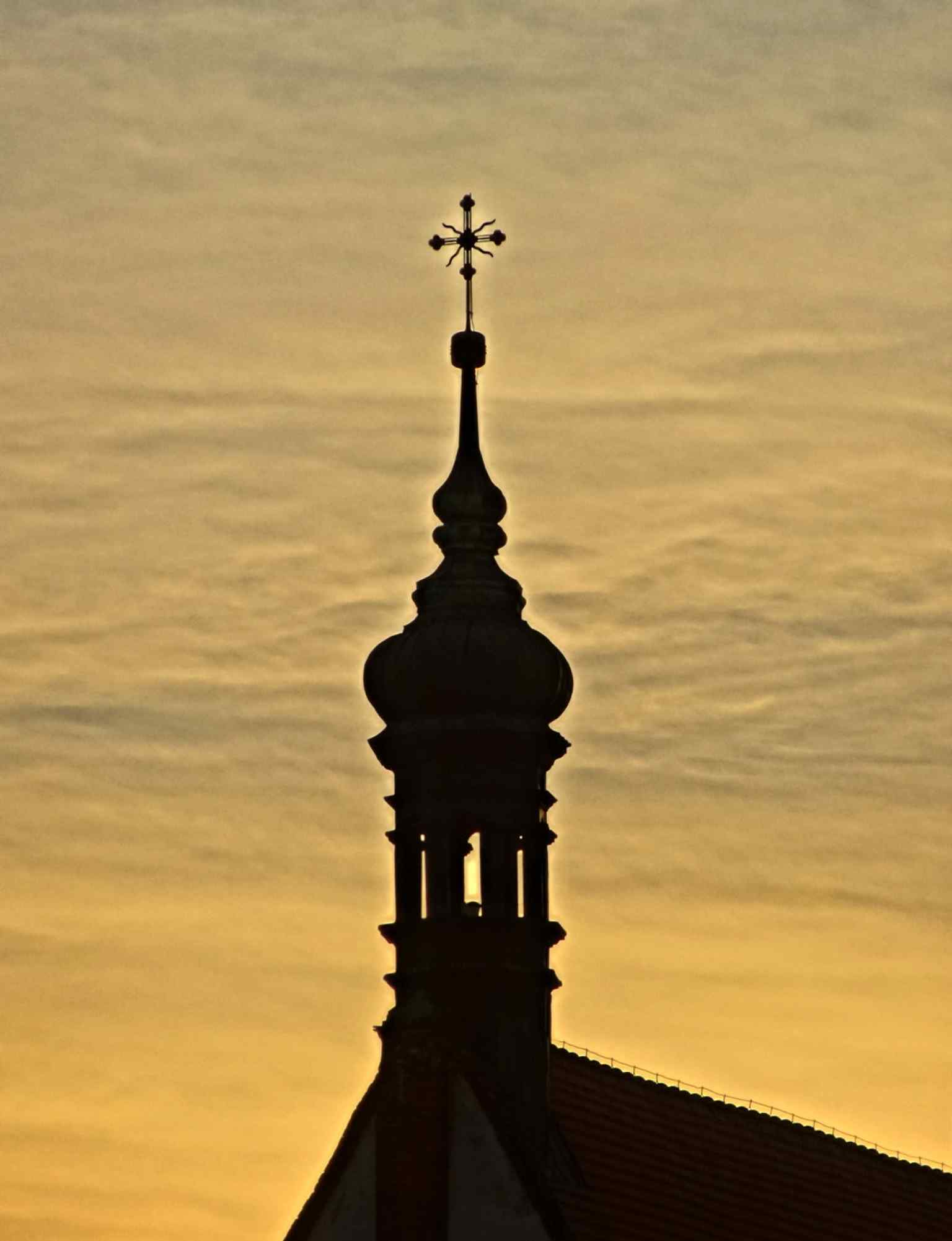 A tighter look at the roof and small ridge turret, recalling the church’s historic signaturka and its long bell tradition.