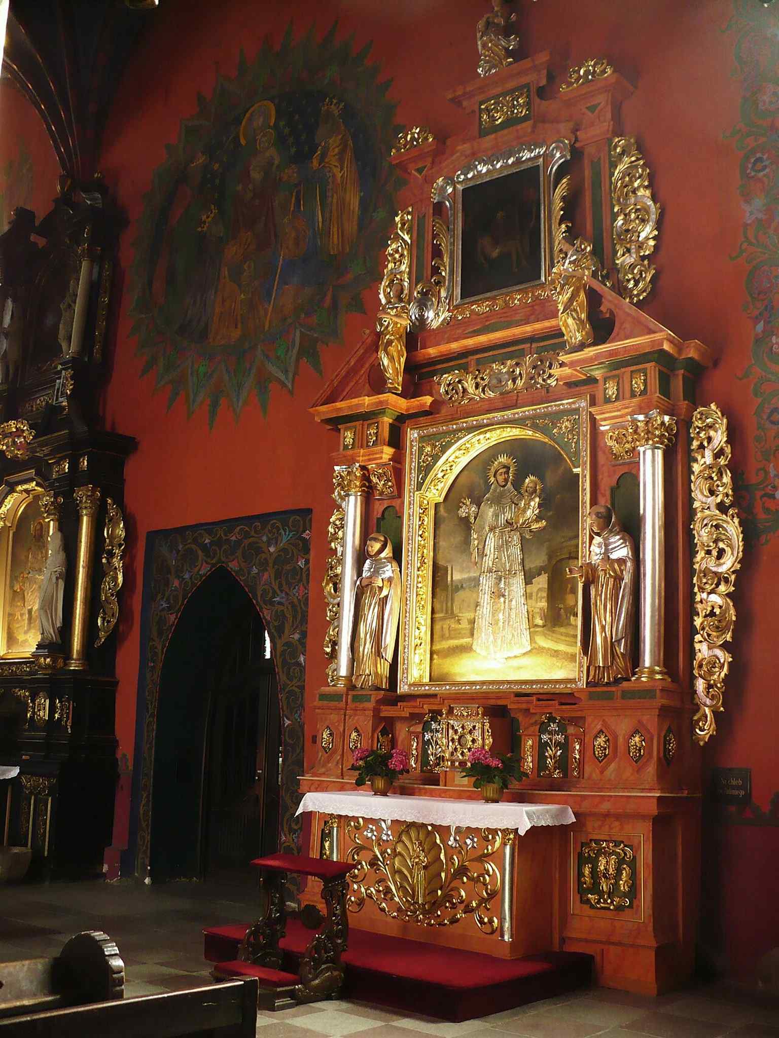 The Baroque Saint Anthony altar, one of the furnishings moved here from demolished Bydgoszcz churches after the Prussian-era losses.