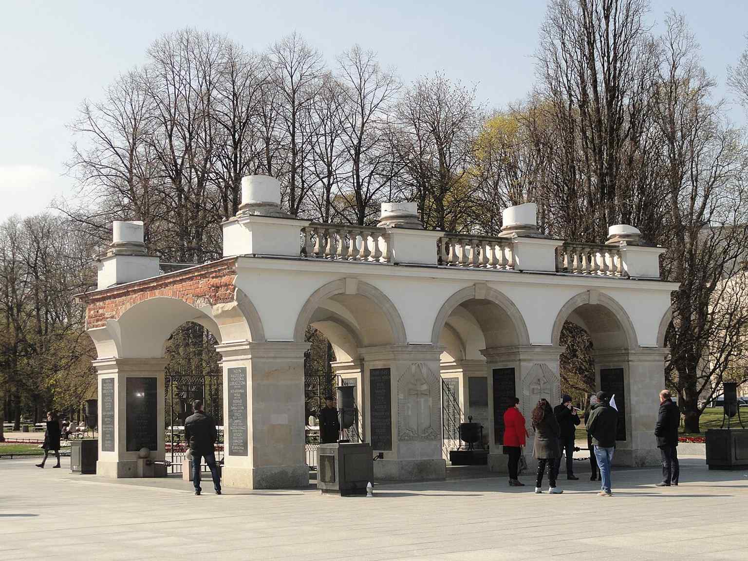 A high-resolution modern view that captures the monument’s restored stonework and the three-arched colonnade fragment in detail.