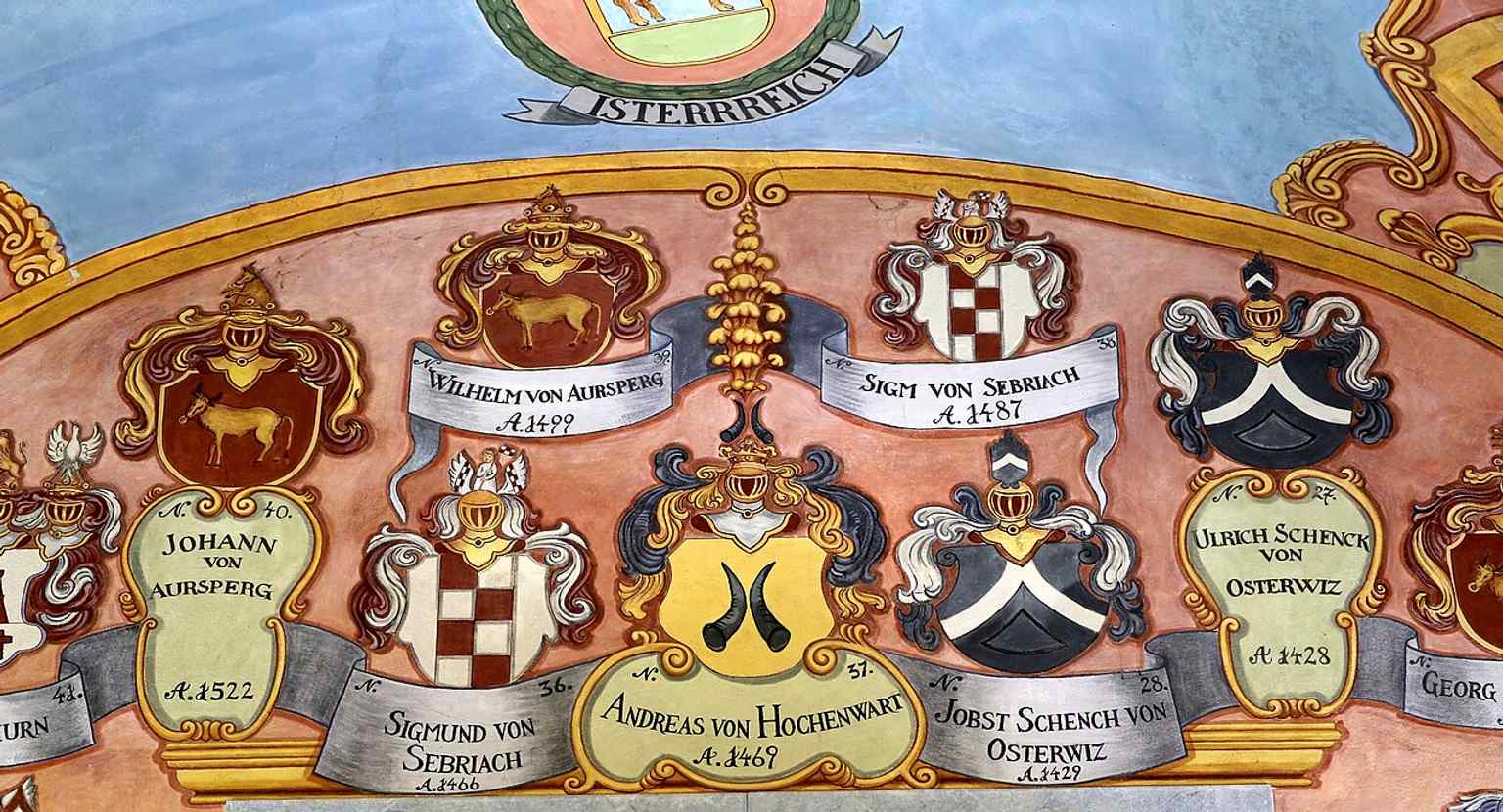This intricate Baroque ceiling in St. George's Chapel, restored in 1747, features the coats-of-arms of provincial governors, reflecting the castle's administrative significance.
