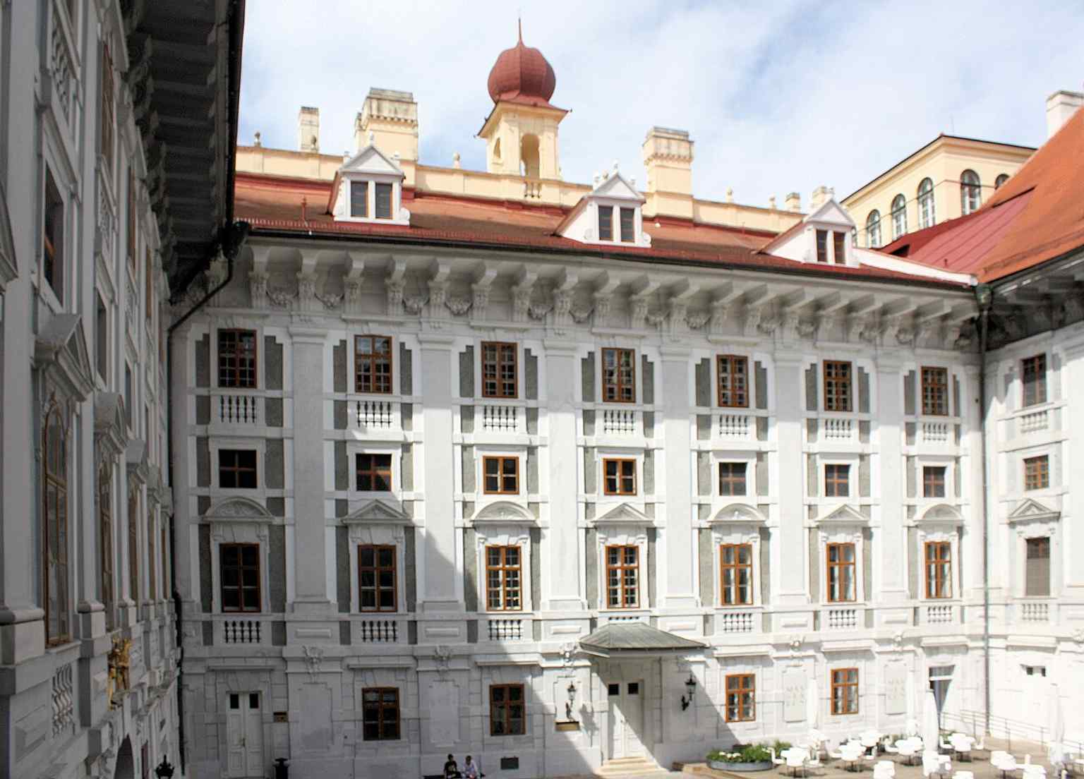 The courtyard perspective gives a sense of the palace as a lived-in complex rather than a single façade.