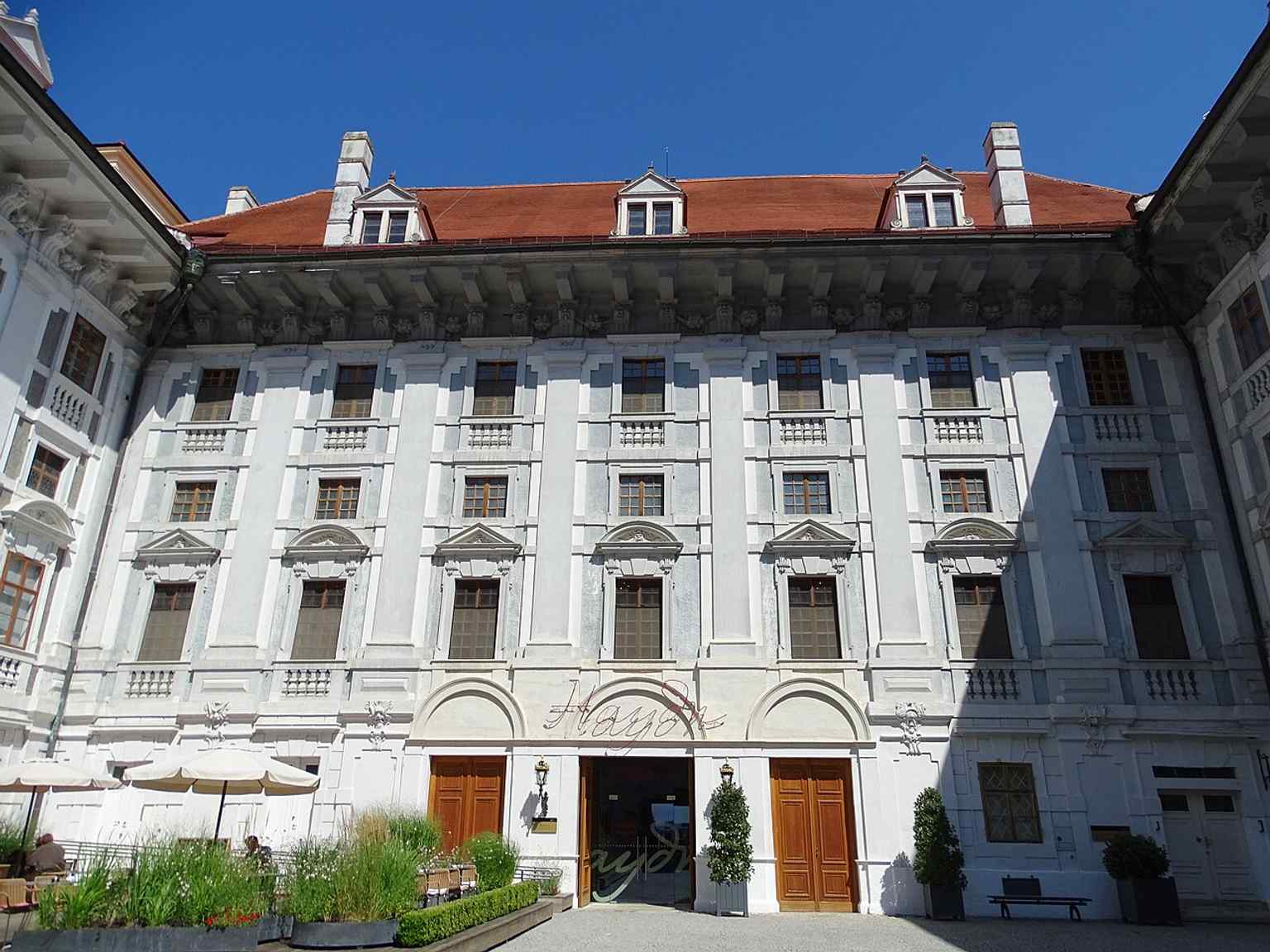 The inner courtyard reveals the layered palace complex, where baroque and later classical elements meet.