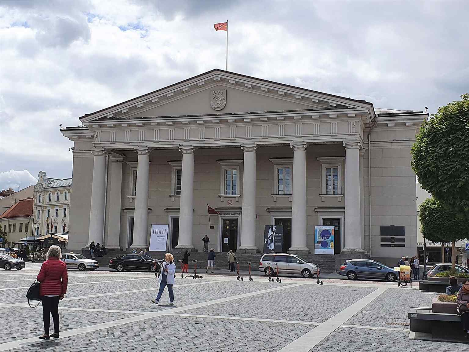 Vilnius Town Hall on the square’s edge — the classical 18th-century building that replaced the earlier city hall and became the square’s defining landmark.