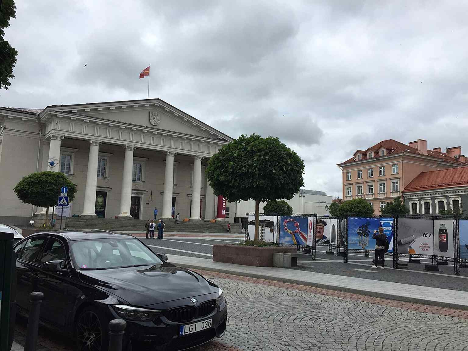 The Town Hall fronted by protest posters — a reminder that this square has long been a stage for public events and political messages.
