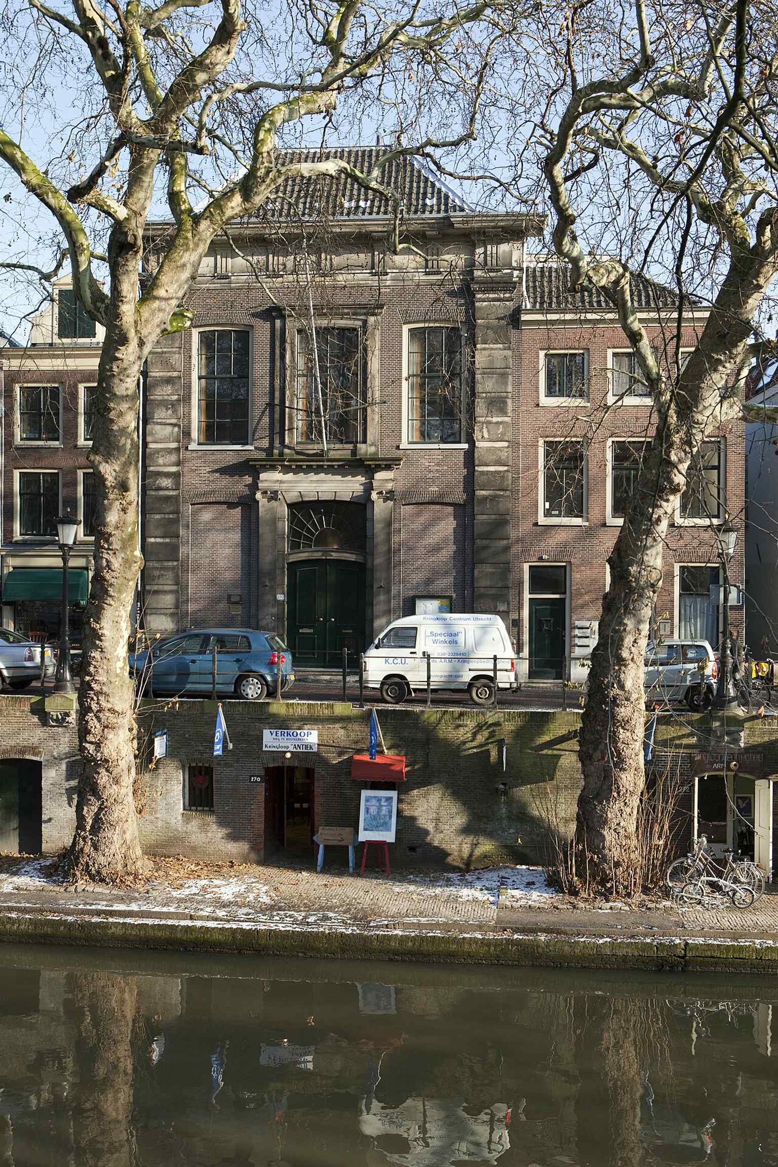 The church's prominent facade on the Oudegracht, designed in 1773 to resemble a stately mansion rather than a visible church due to the Mennonites' tolerated status at the time.