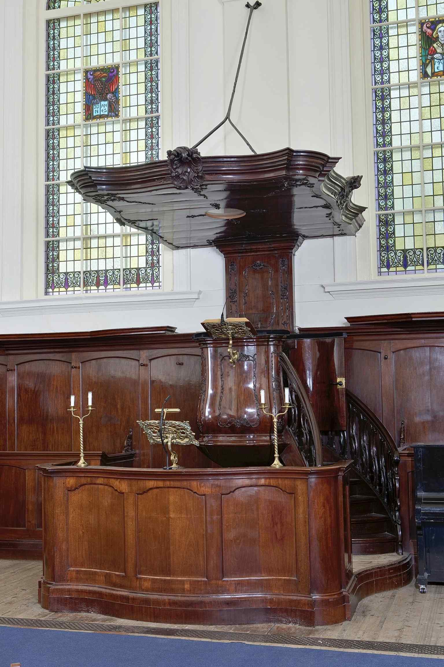 The simple yet elegant pulpit, a key feature of the church's 18th-century interior, executed in the strict Louis XVI style.