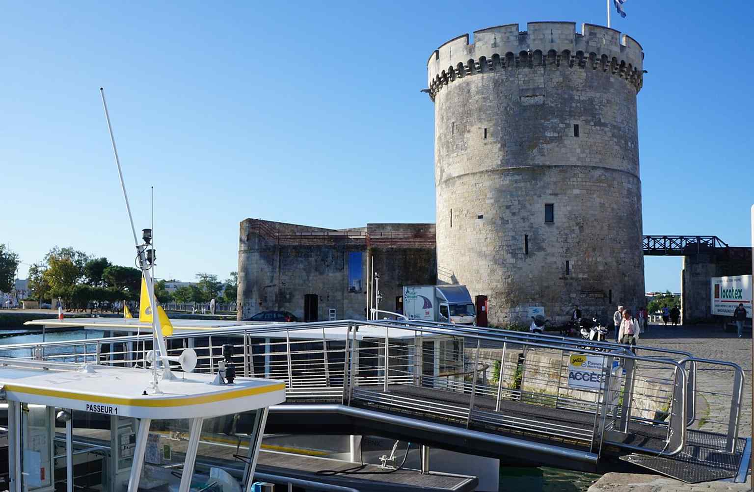 The Chain Tower seen from the waterfront, a strong image for explaining its role as the port’s defensive threshold.