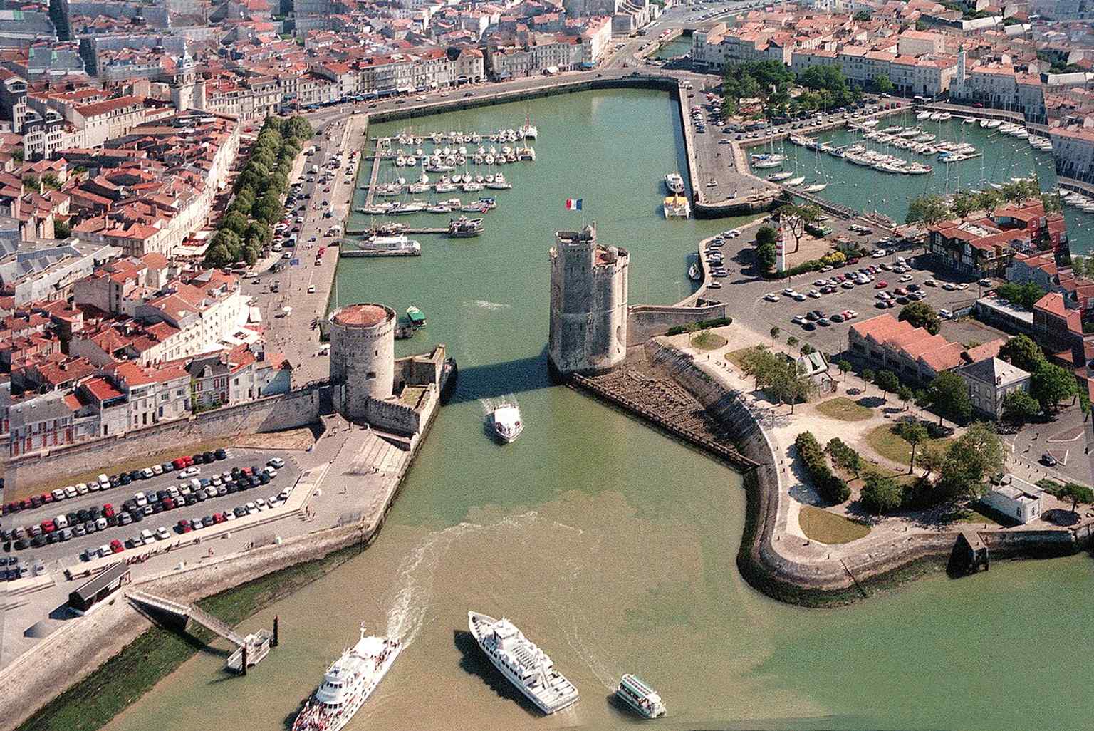 A broad composition with the Chain Tower and Saint-Nicolas together, perfect for the story of the chain stretched between the two towers.