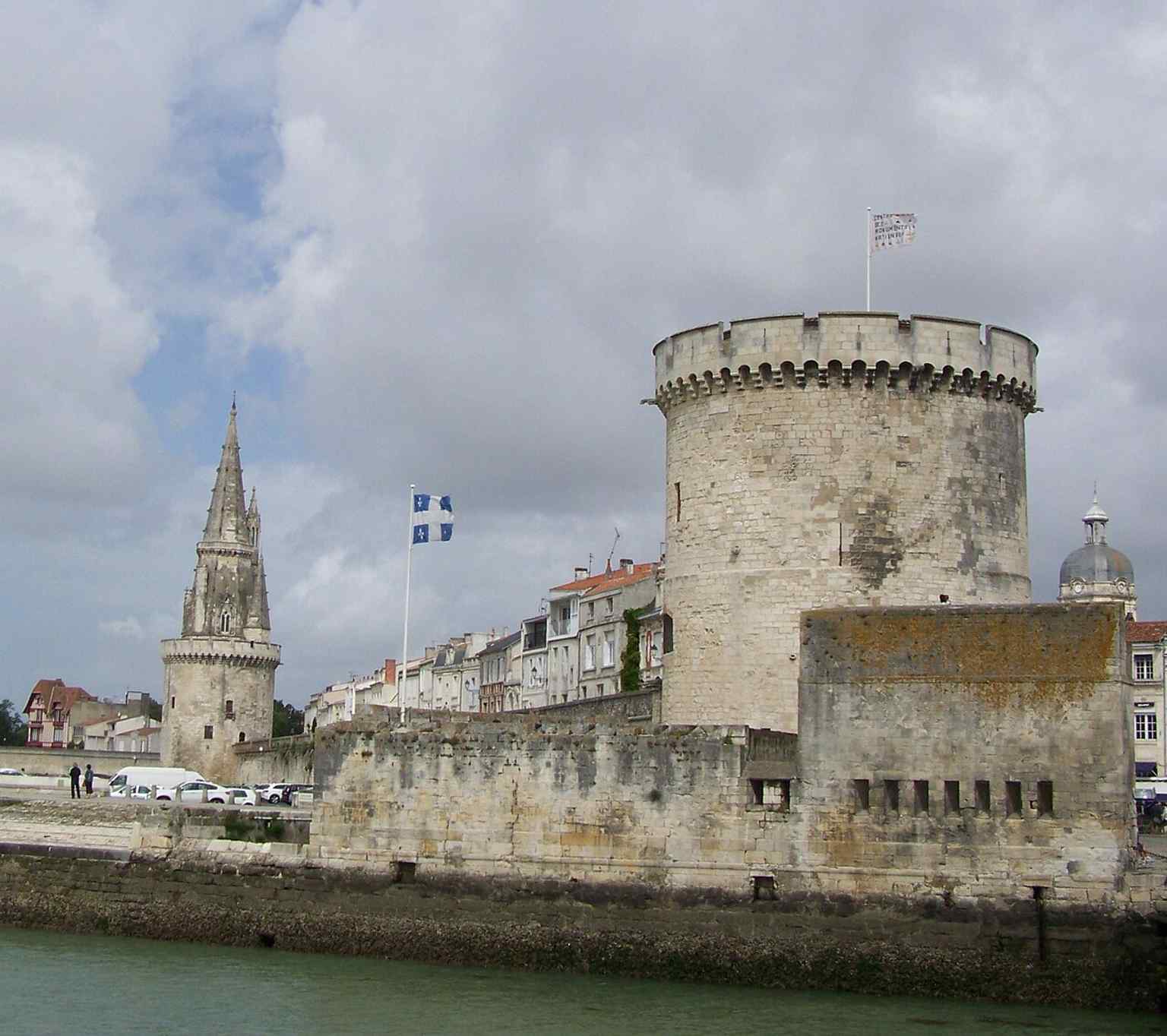 The Chain Tower with the Lantern Tower, recalling the three fortifications named in the source text and the surviving seafront defenses.