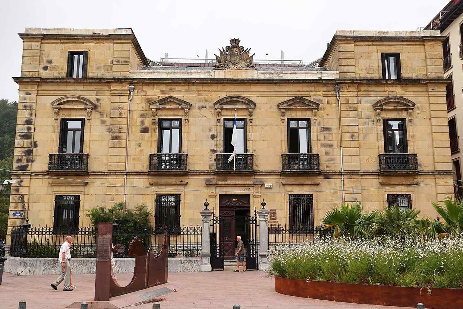 The main façade of Goicoa Palace, the former Military Government headquarters facing San Sebastián’s Old Town, where the building’s 19th-century military history still reads in its formal stonework.