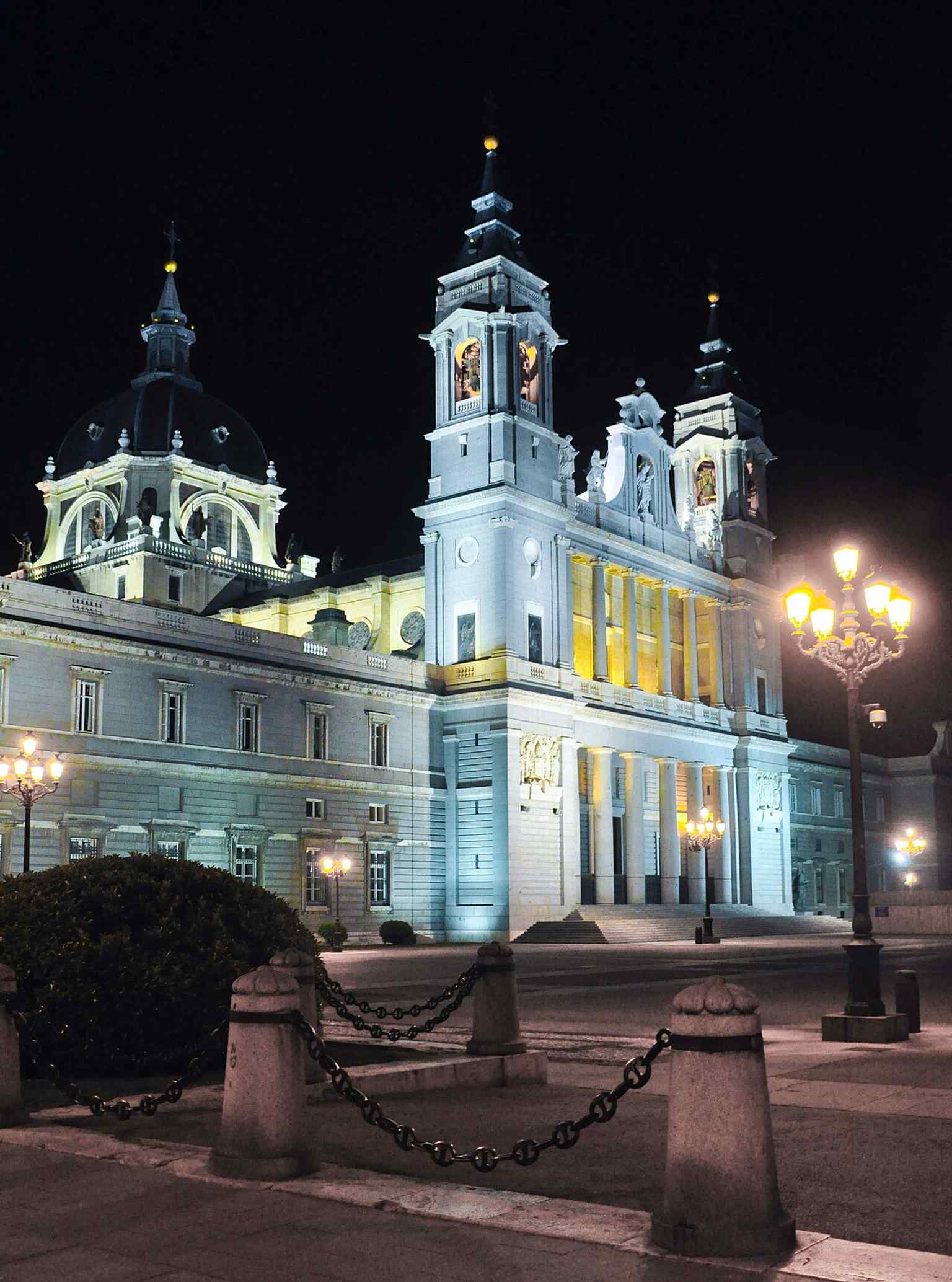 The cathedral illuminated at night, a dramatic look at one of Madrid’s most recognizable religious landmarks.