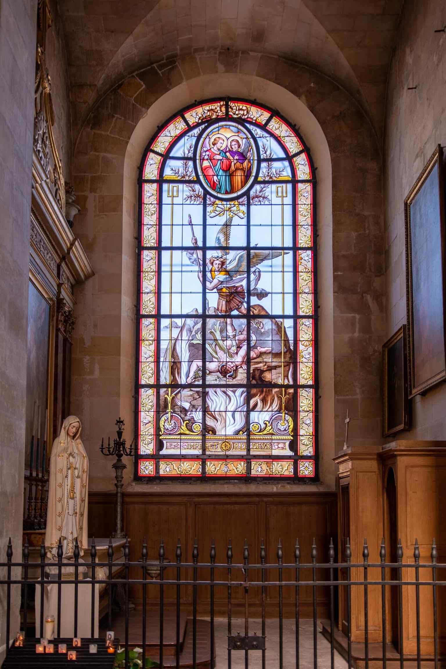 A close look at modern stained glass inside the cathedral, where later windows continue the building’s long layer-cake of art and restoration.