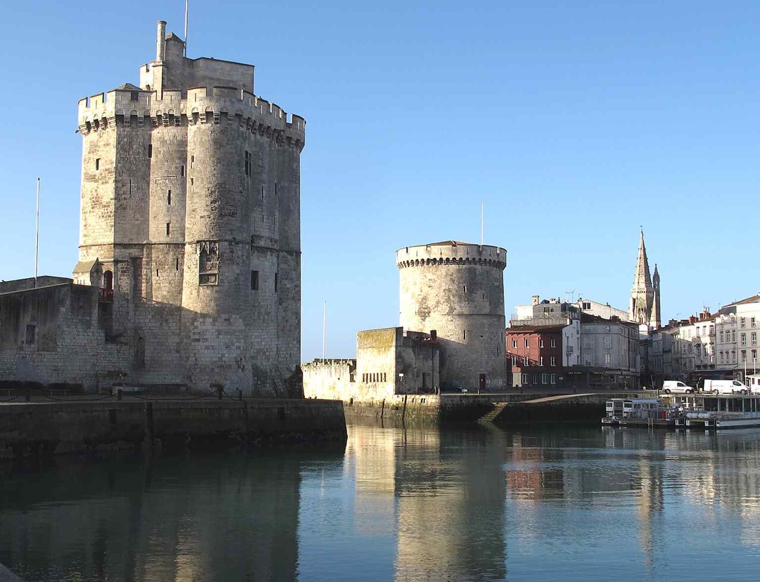 A wider view of the three La Rochelle towers, helping place the Lantern Tower in the city’s fortified harbor front.