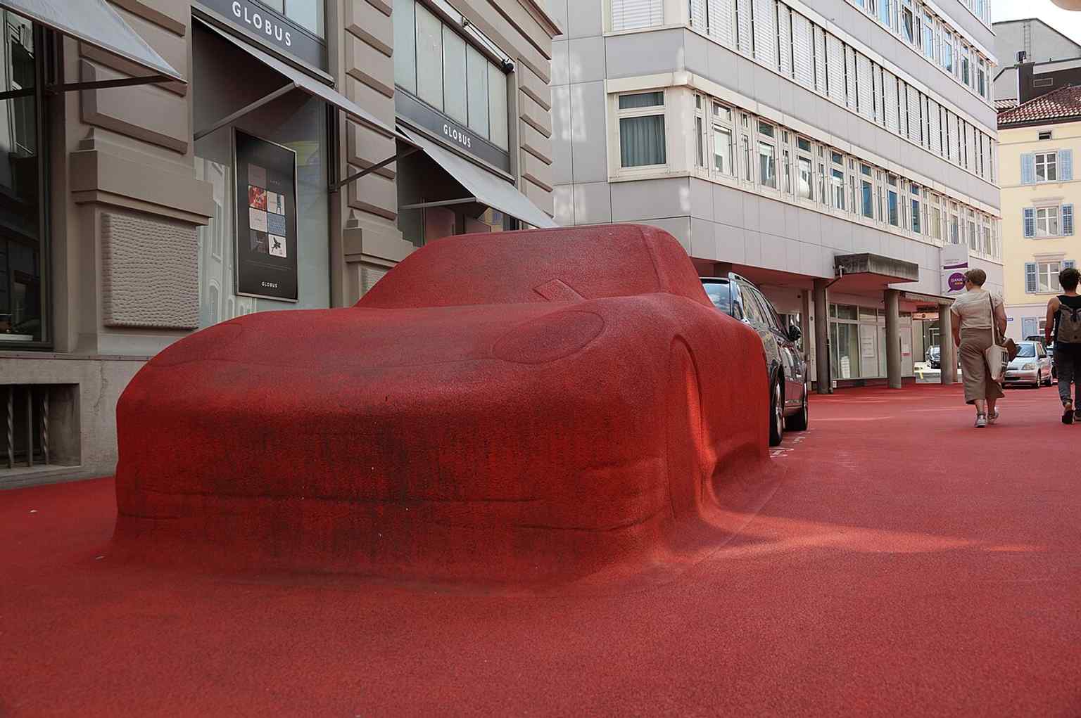 A broad view of the red-carpet-like City Lounge surface — the place is designed as a 4,600 m² public living room in St. Gallen.