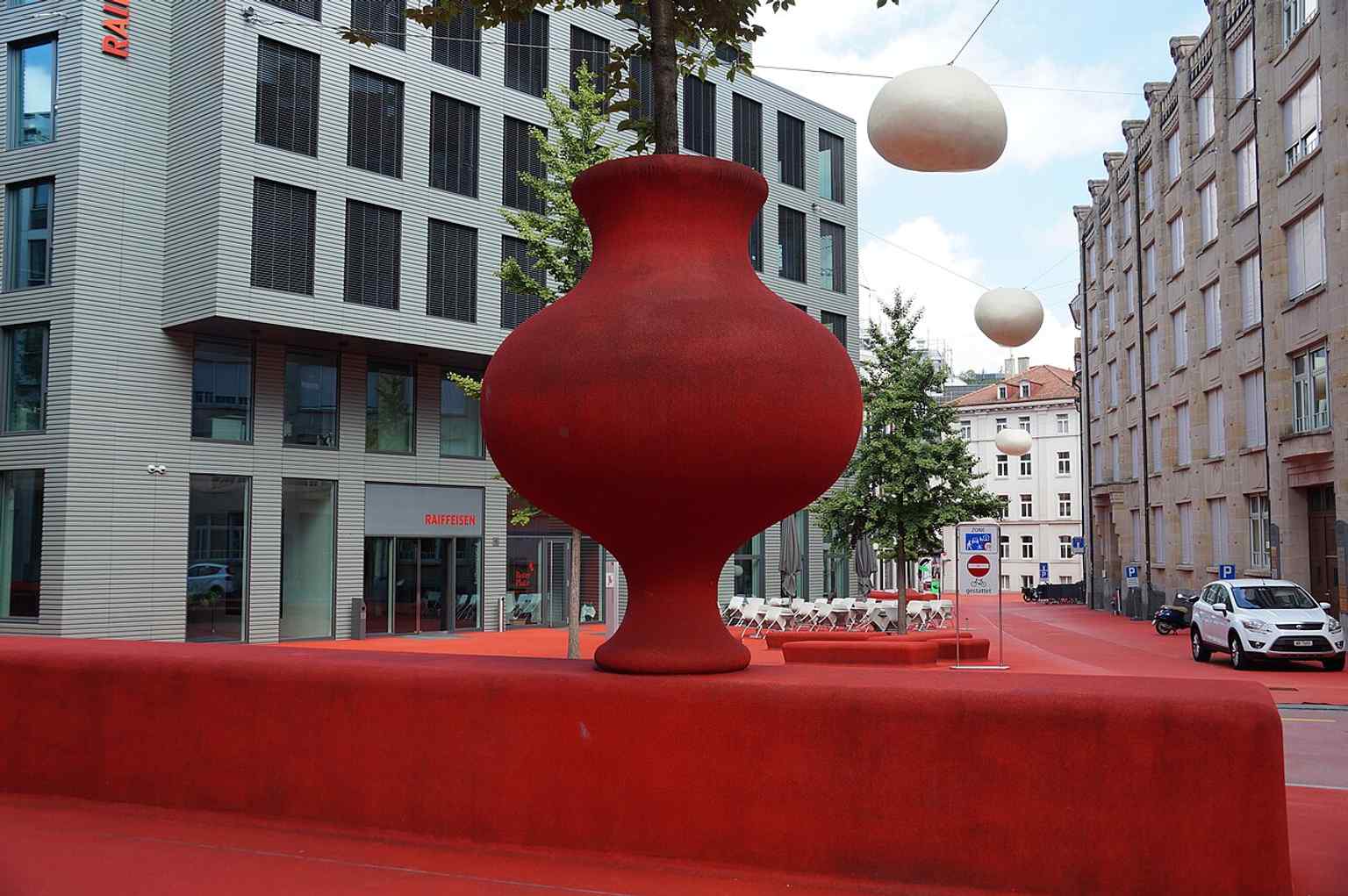 A closer look at the red flooring and built-in seating that gave the project its nickname, the “Red Square”.