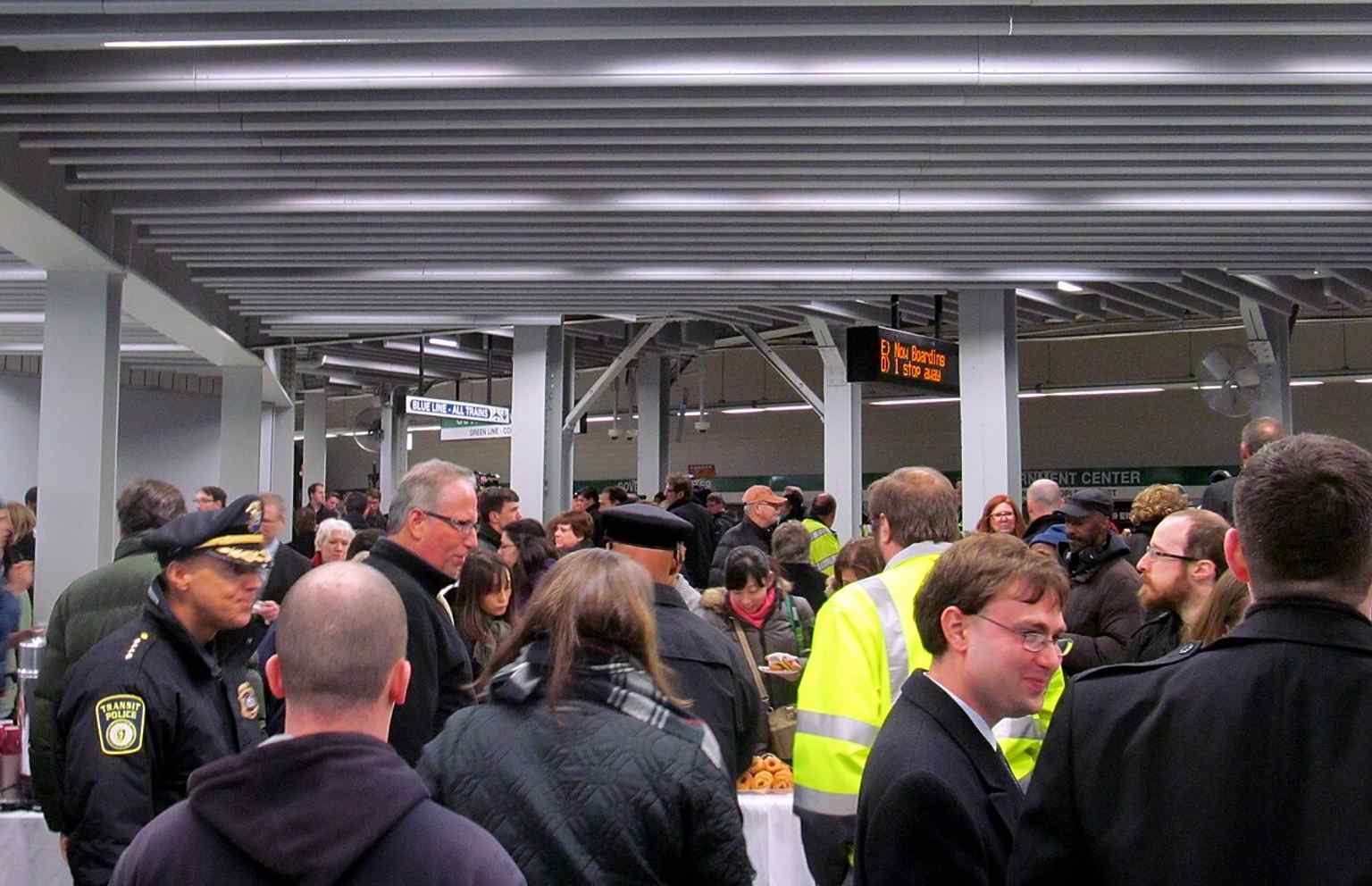 Crowds moving onto the Green Line level on reopening day, showing how important Government Center is as a downtown transfer station.