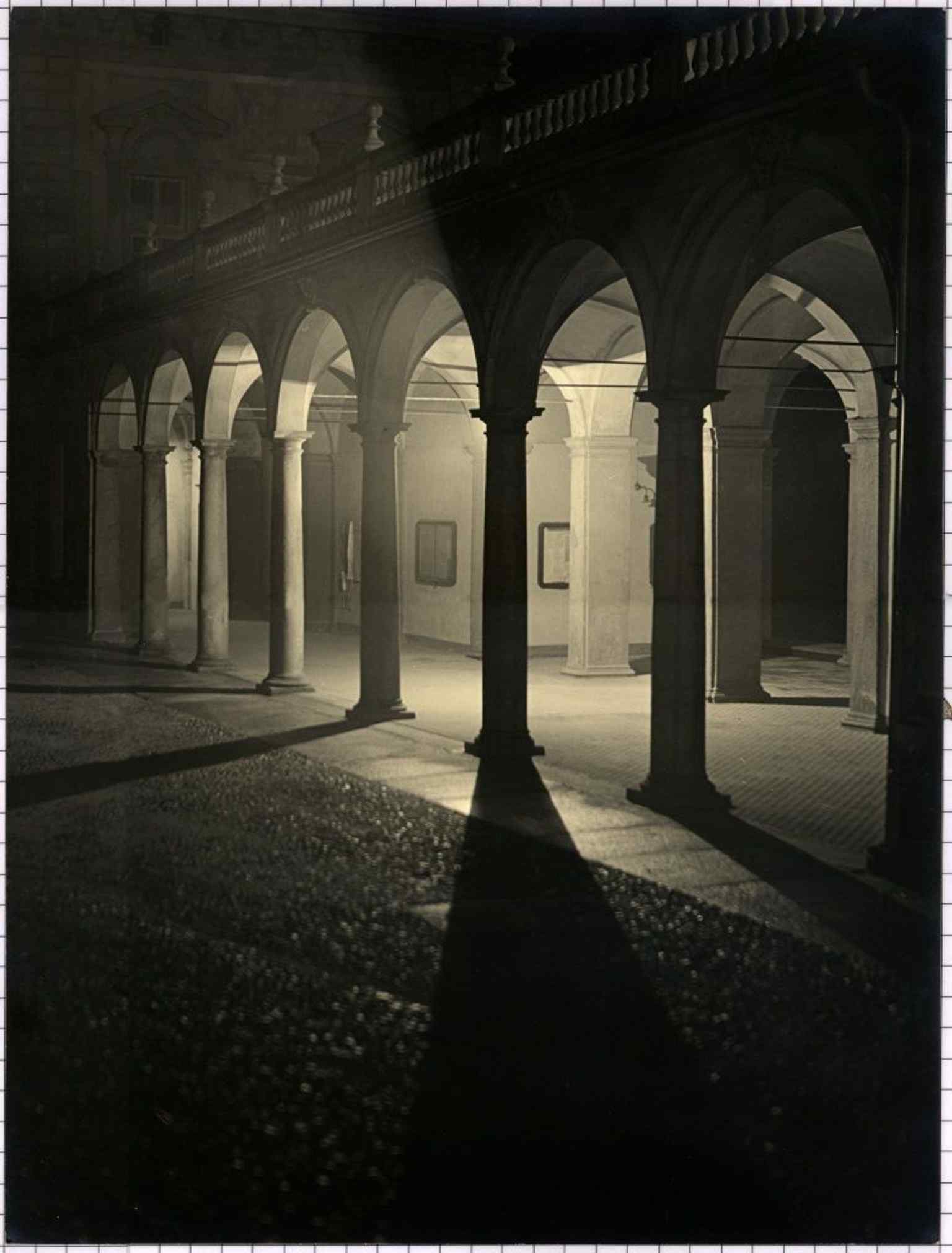 A shadowy night view of the castle's right wing portico from 1935, perfectly evoking the chilling legends that surround Madama Cristina's reign.