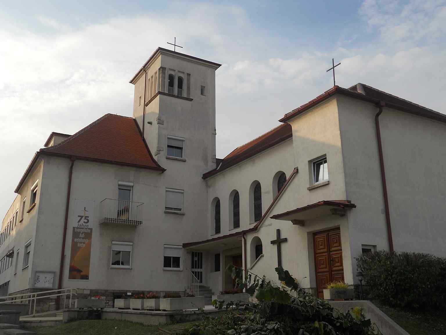 The Evangelical parish church and parsonage at St.-Rochus-Straße 1 — the 1935 church ensemble that grew out of Eisenstadt’s small but established Lutheran community.