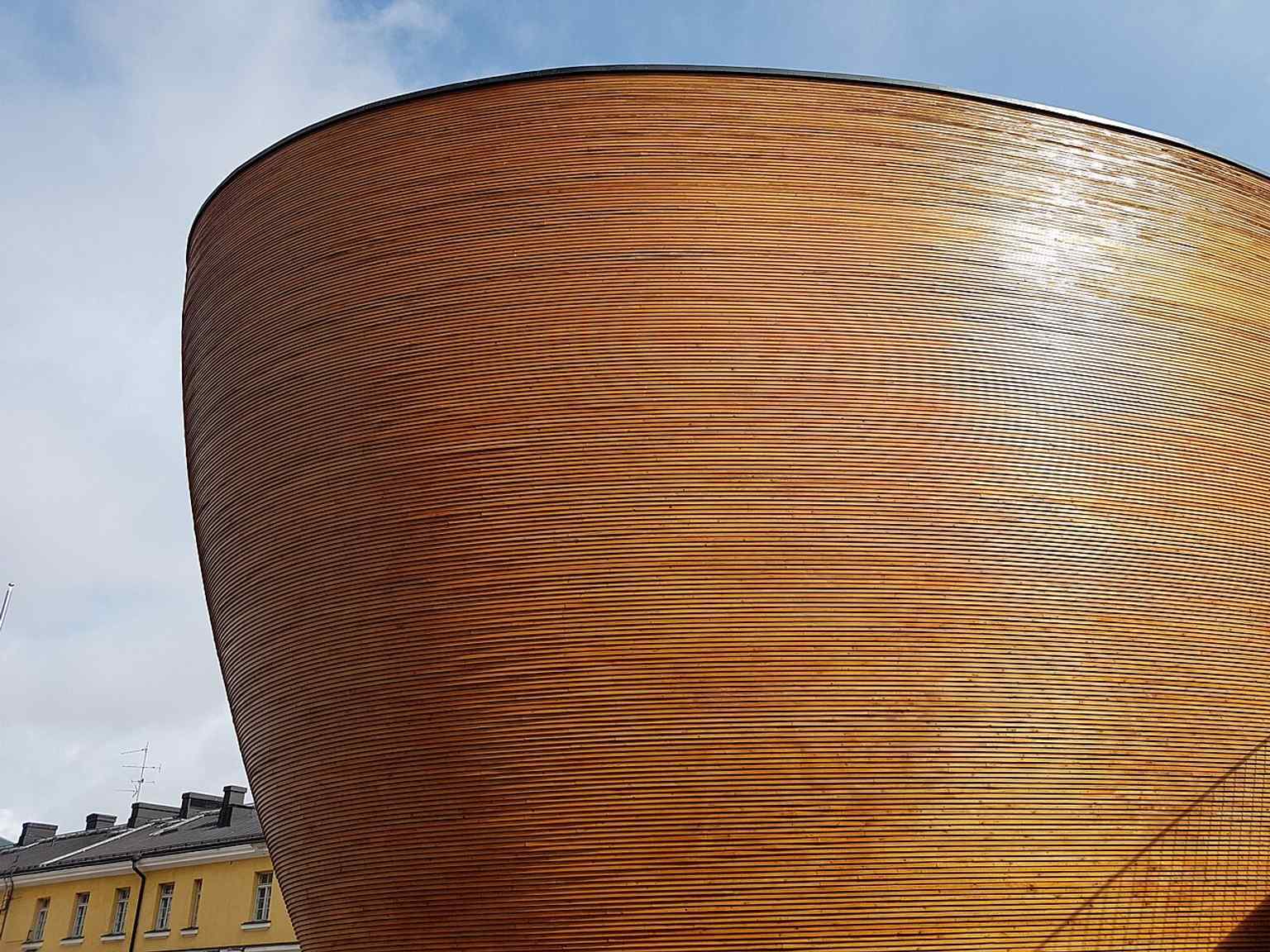 The smooth wooden exterior of Kamppi Chapel, the quiet design landmark that opened in 2012 on the edge of Narinkkatori.